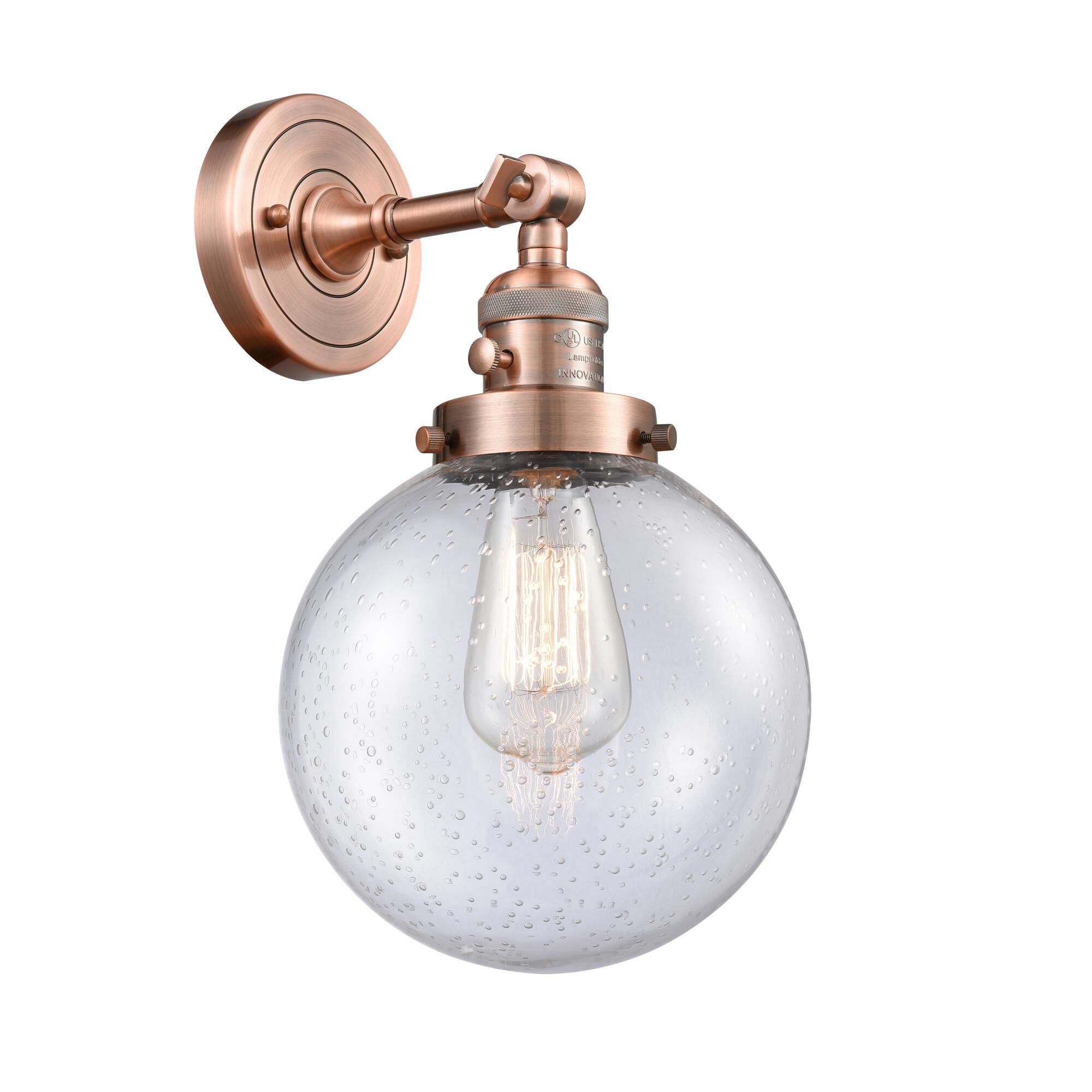Shown in Antique Copper finish and Seedy glass and Switch on Socket accent