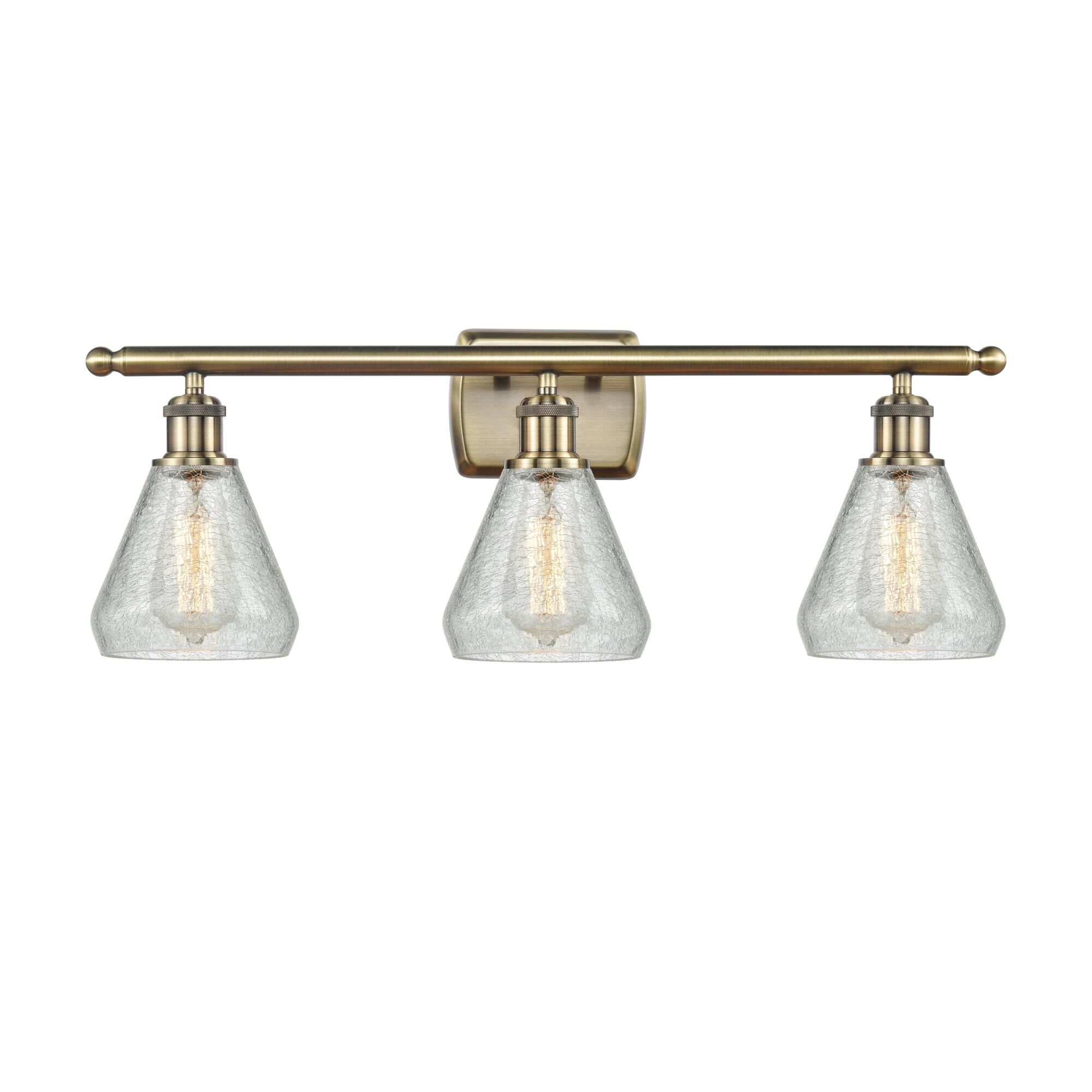Shown in Antique Brass finish and Cone glass and Glass shade and Polished Chrome accent