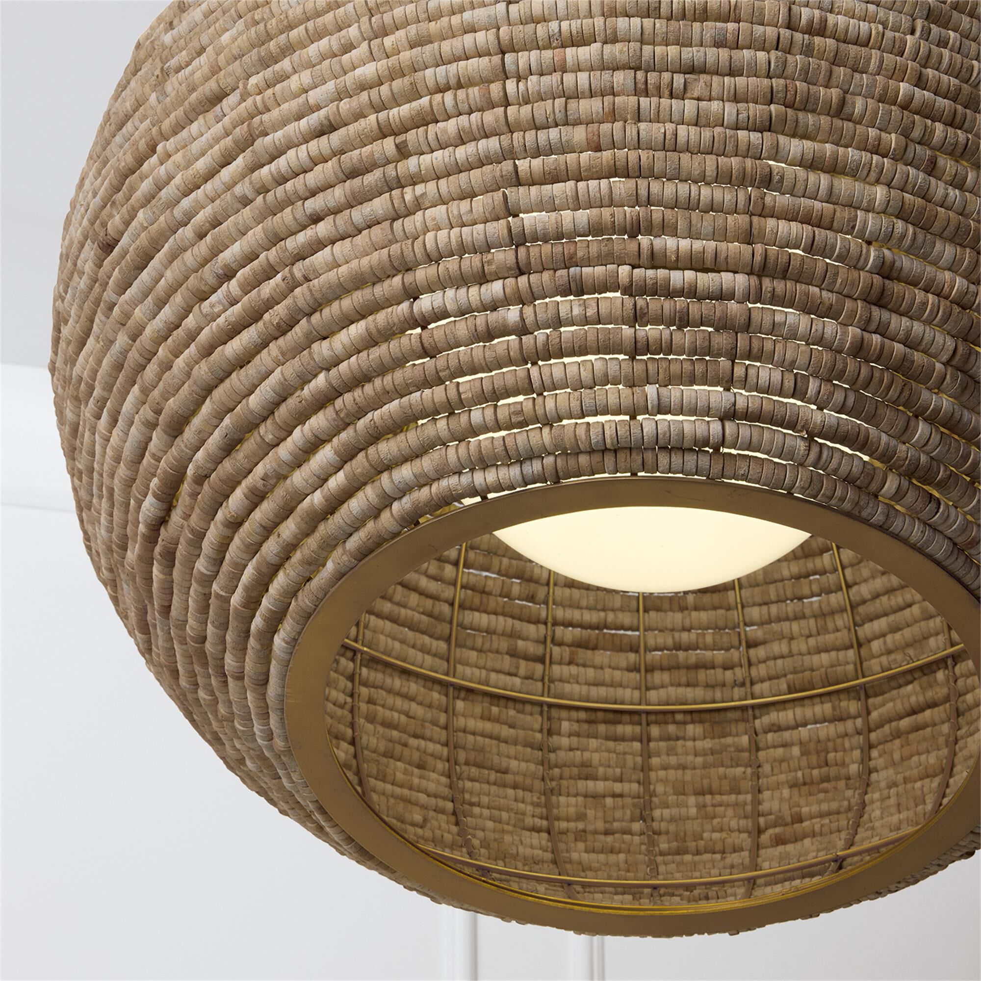 Shown in Light Fawn And Matte Brass finish and White  Globe glass