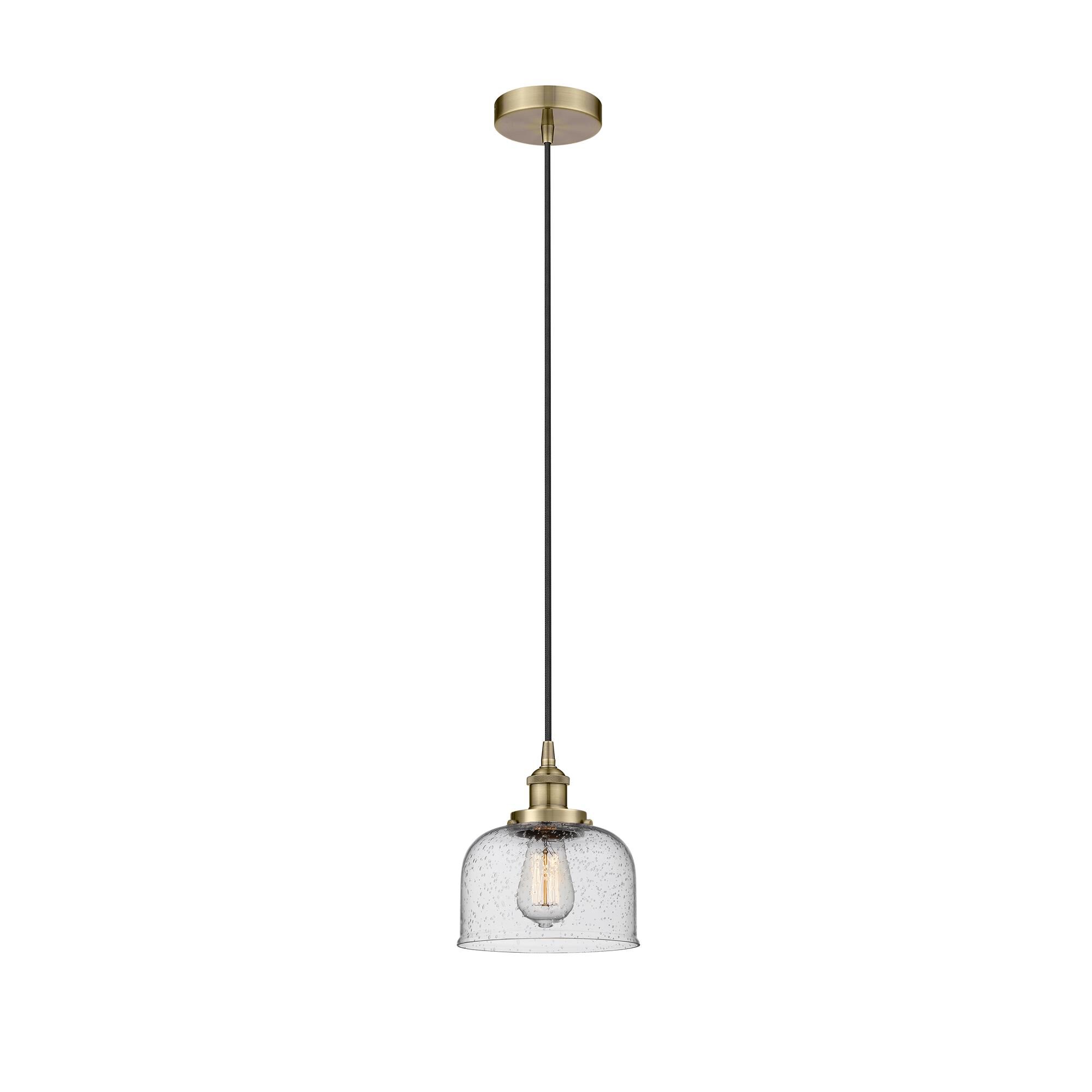 Shown in Antique Brass finish and Seedy glass