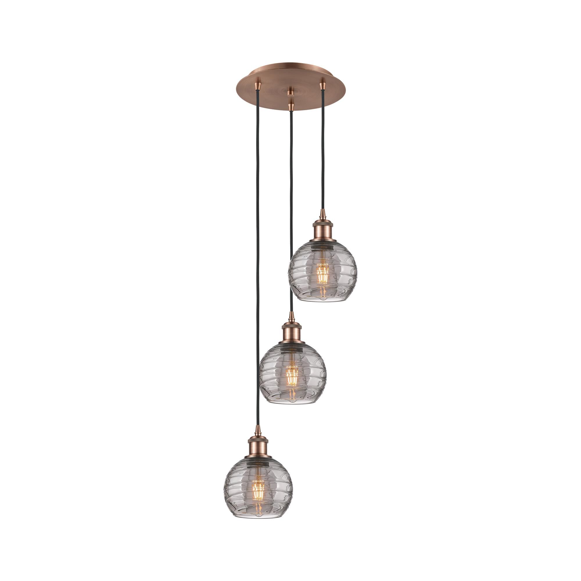 Shown in Antique Copper finish and Light Smoke Deco Swirl glass