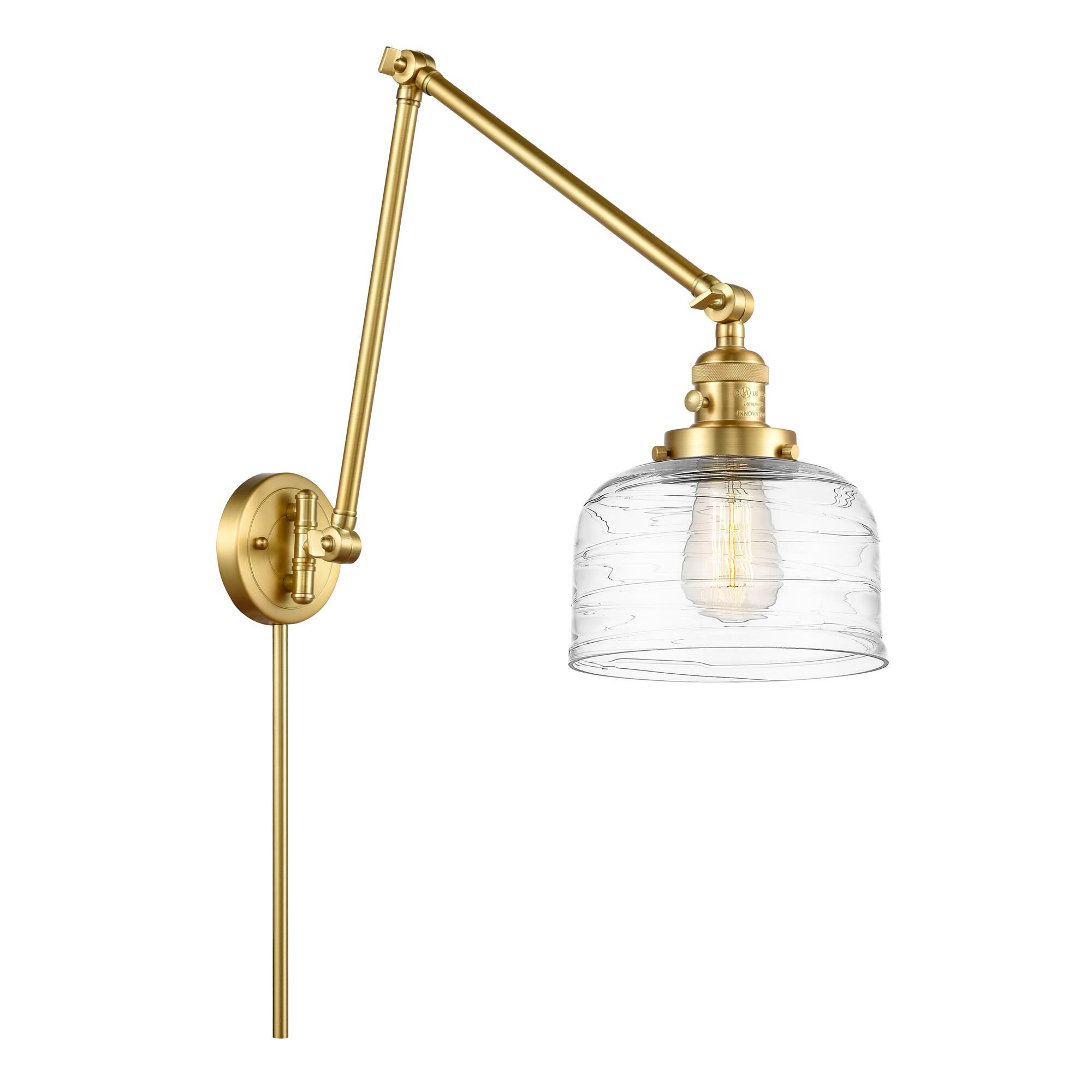 Shown in Satin Gold finish and Clear Deco Swirl Large Bell glass