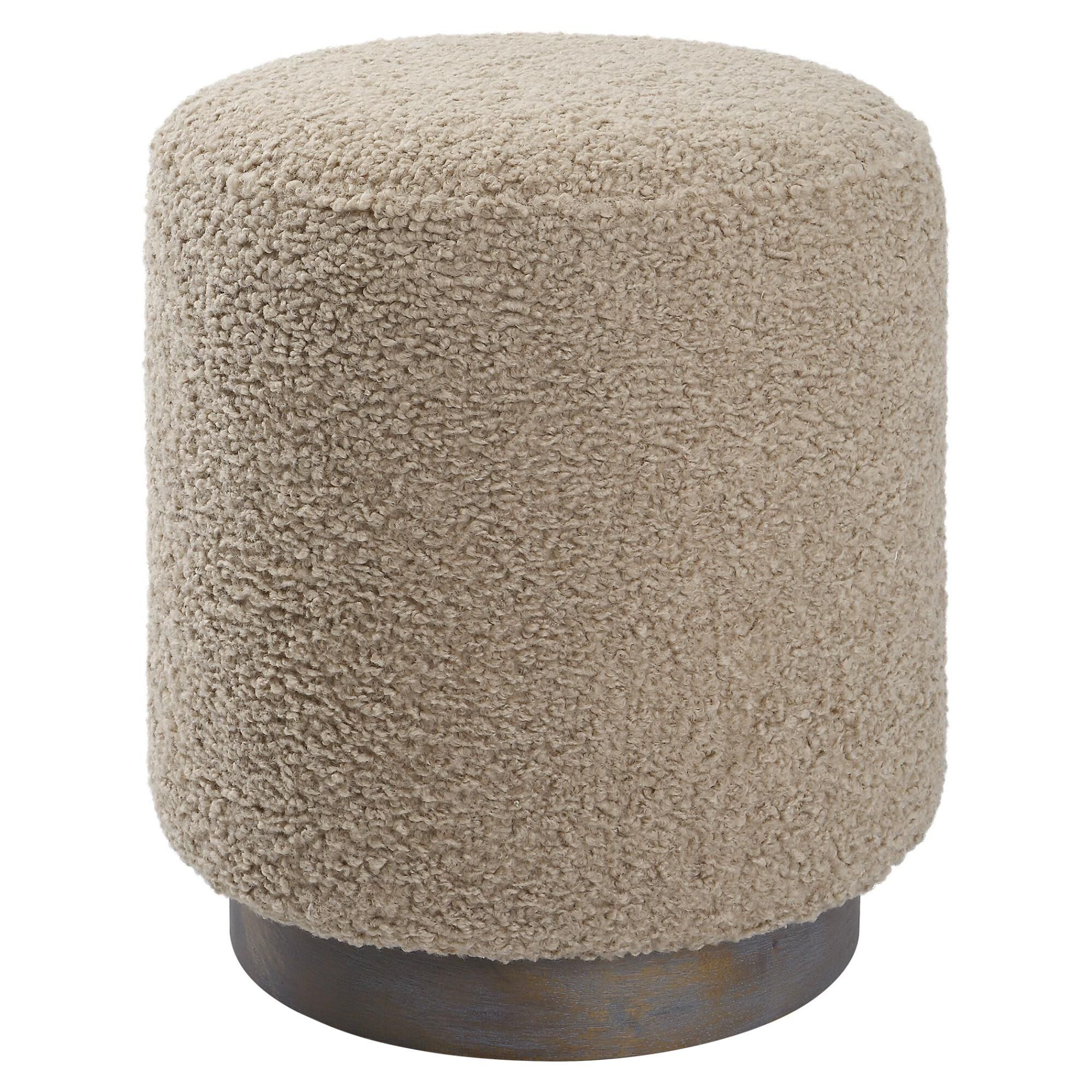 Shown in This Plush Ottoman Is Covered In A Casual Latte Toned Faux Shearling With A Natural Walnut Stained O finish