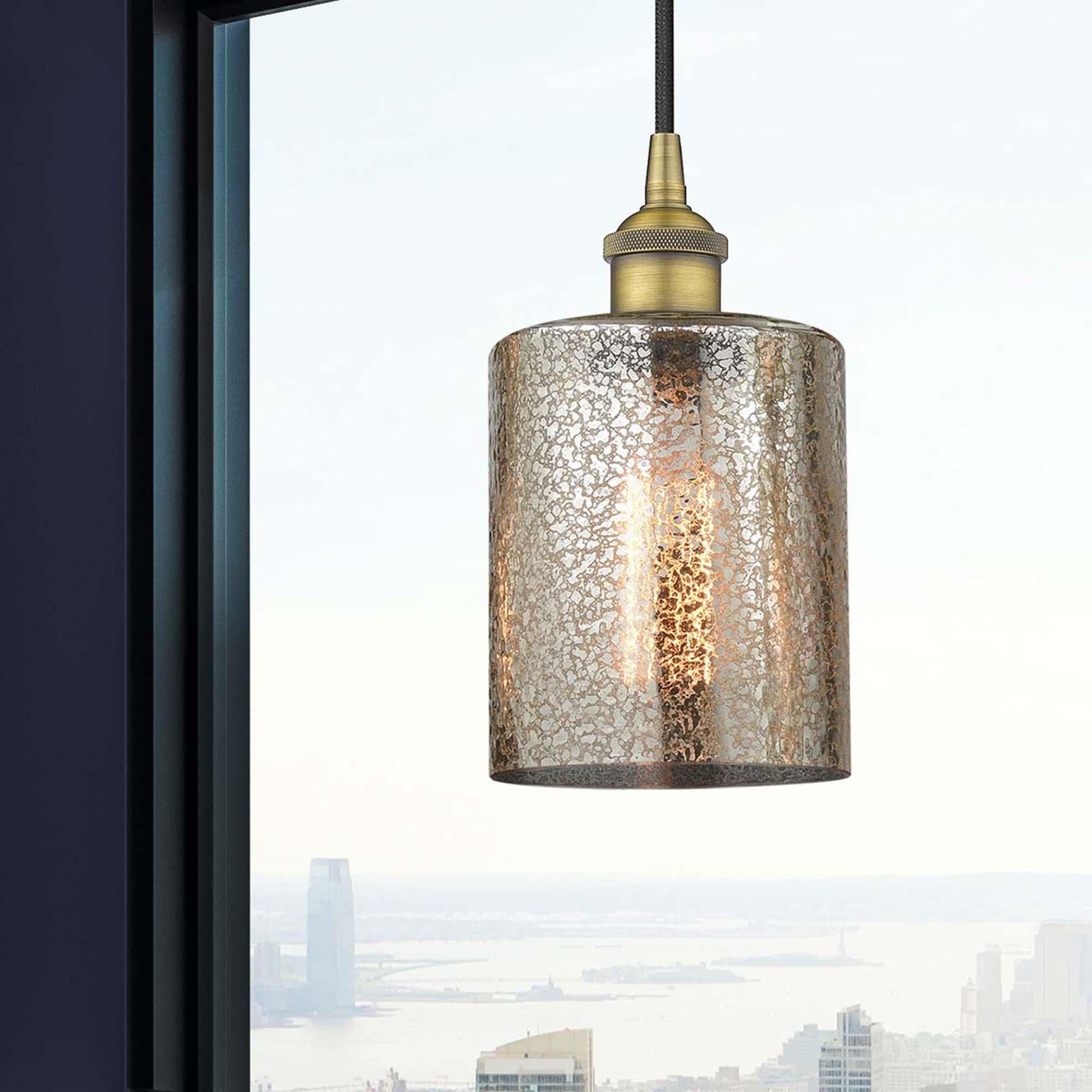 Shown in Brushed Brass finish and Mercury glass