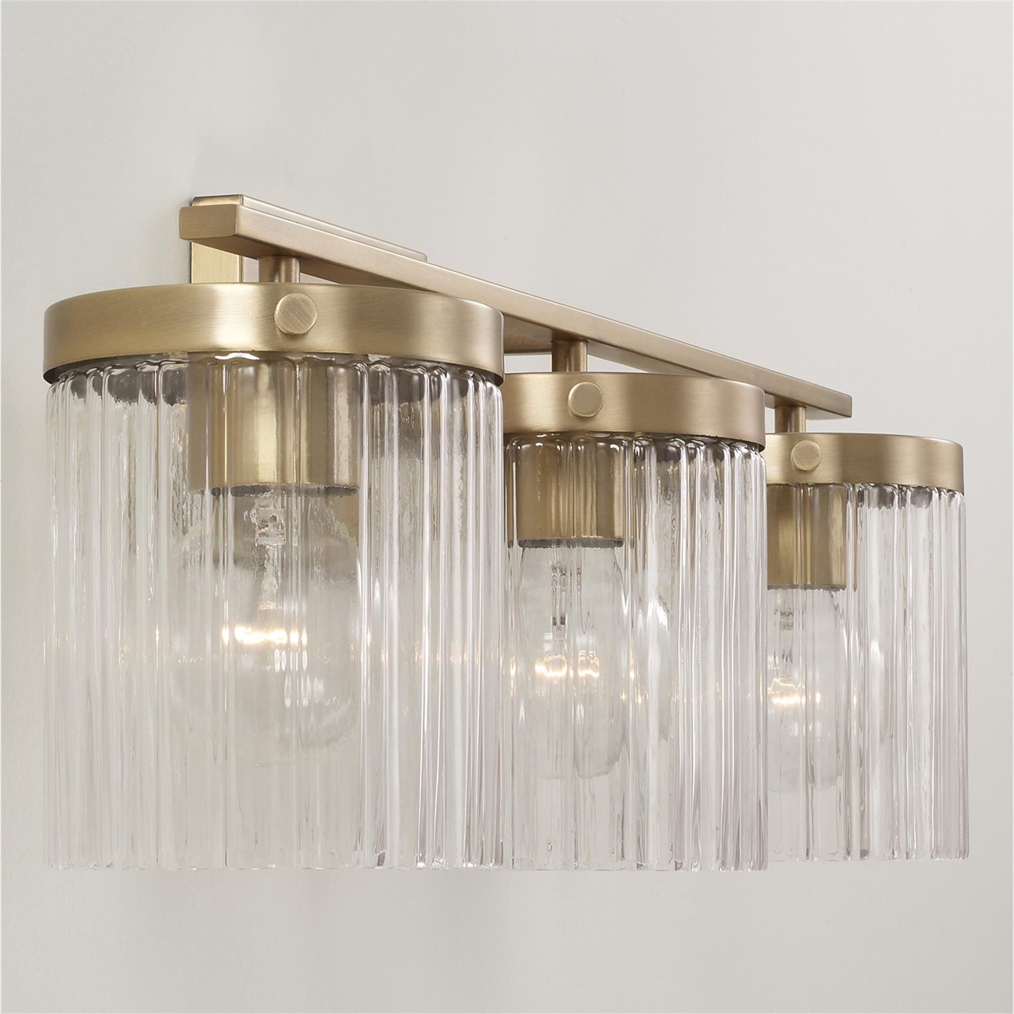 Shown in Aged Brass finish and Beveled Fluted glass