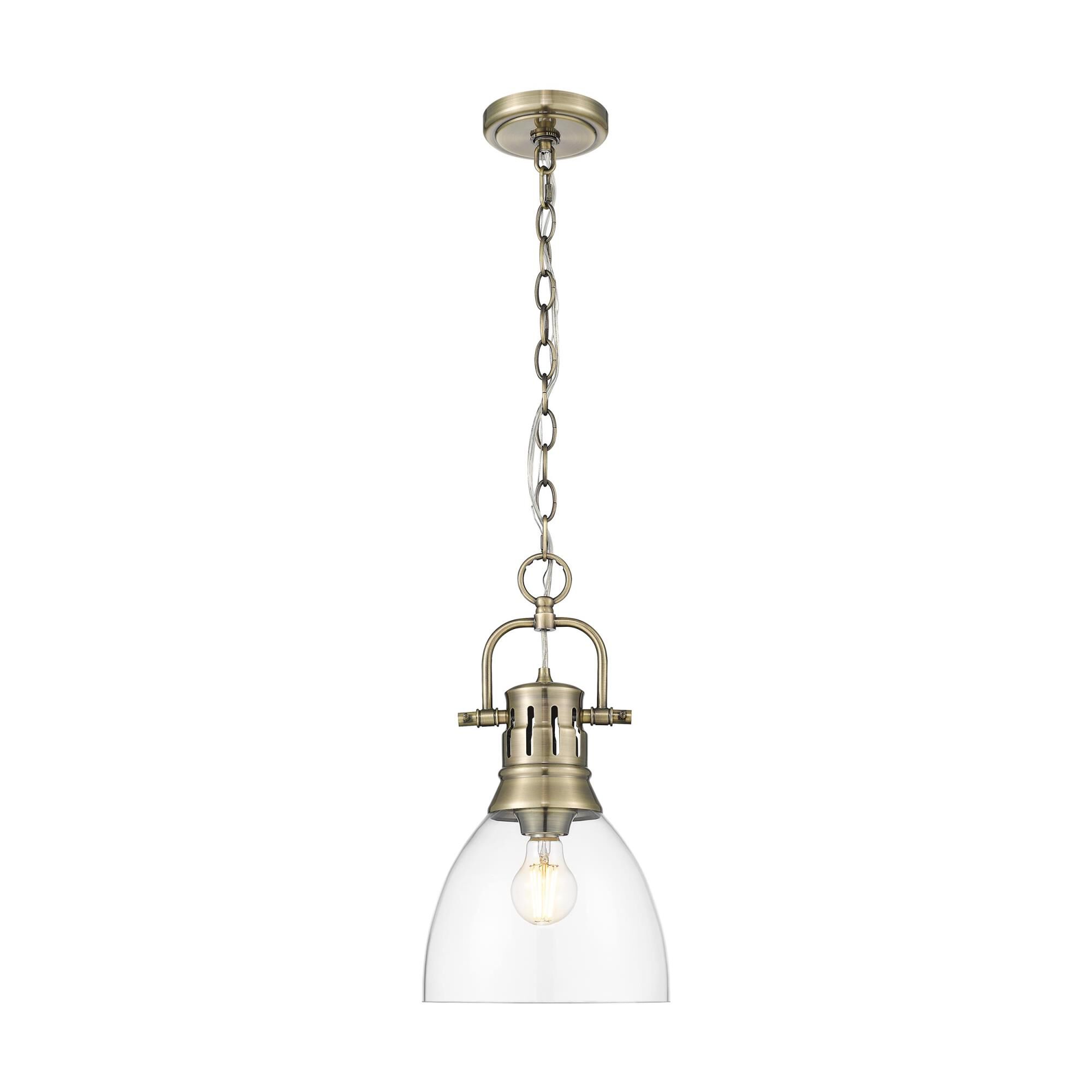 Shown in Aged Brass finish and Clear Glass shade