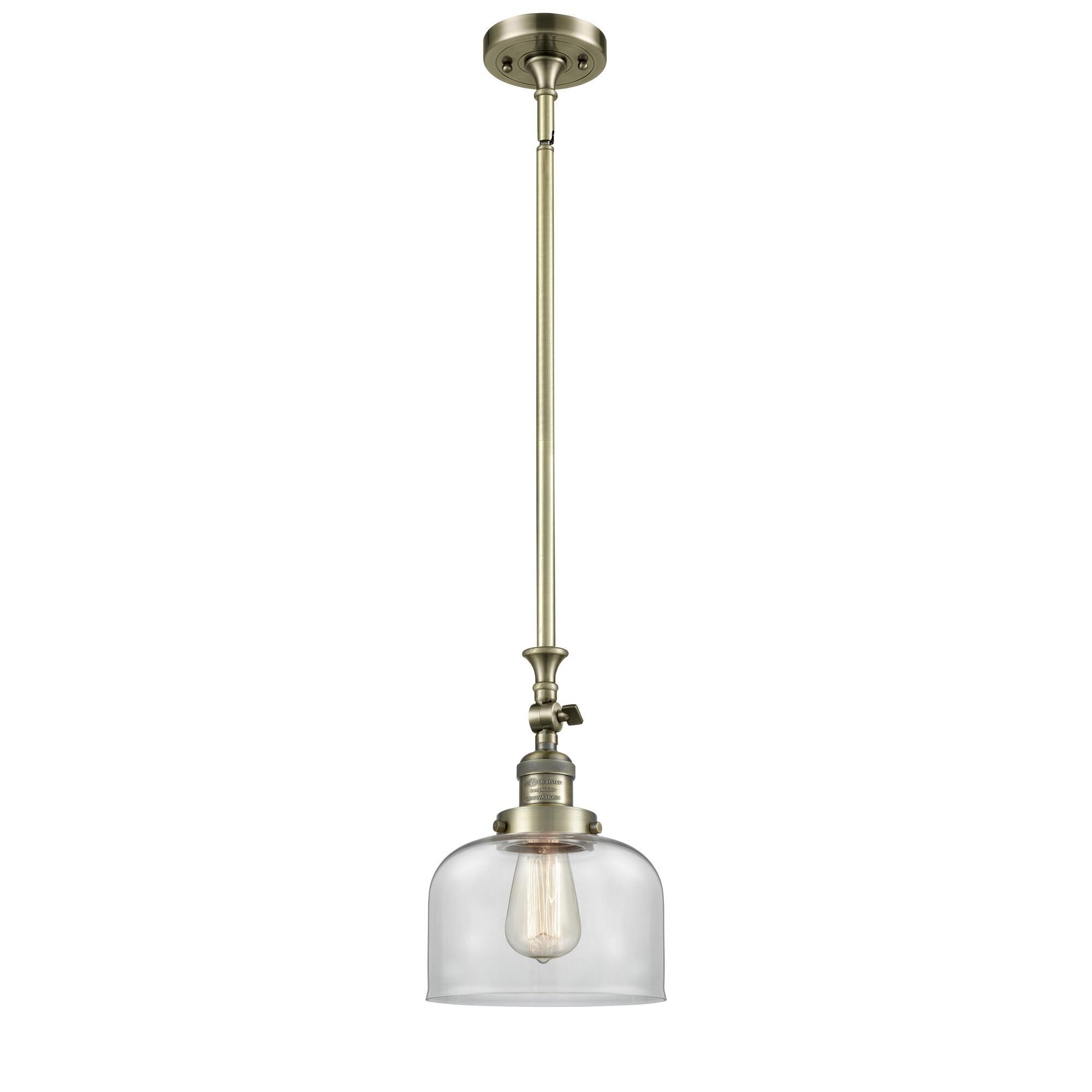 Shown in Antique Brass finish and Clear glass