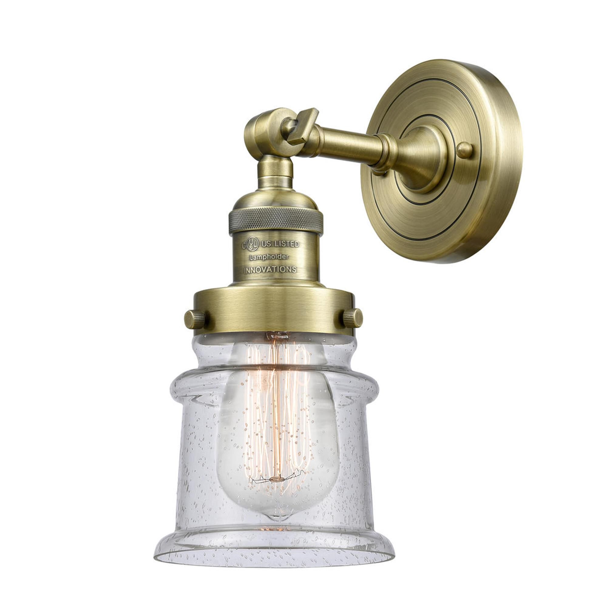 Shown in Antique Brass finish and Seedy glass