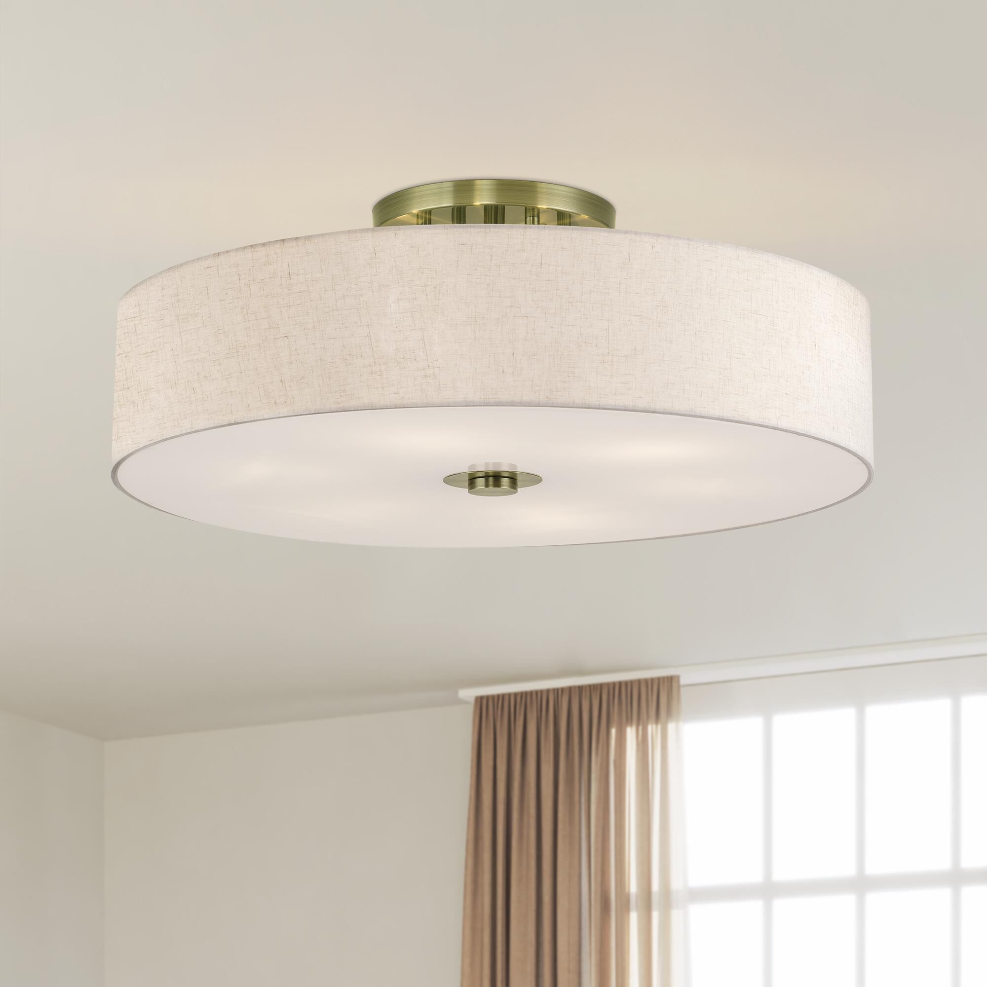 Shown in Antique Brass finish and Hand Crafted Oatmeal Color Fabric with White Color Inside shade