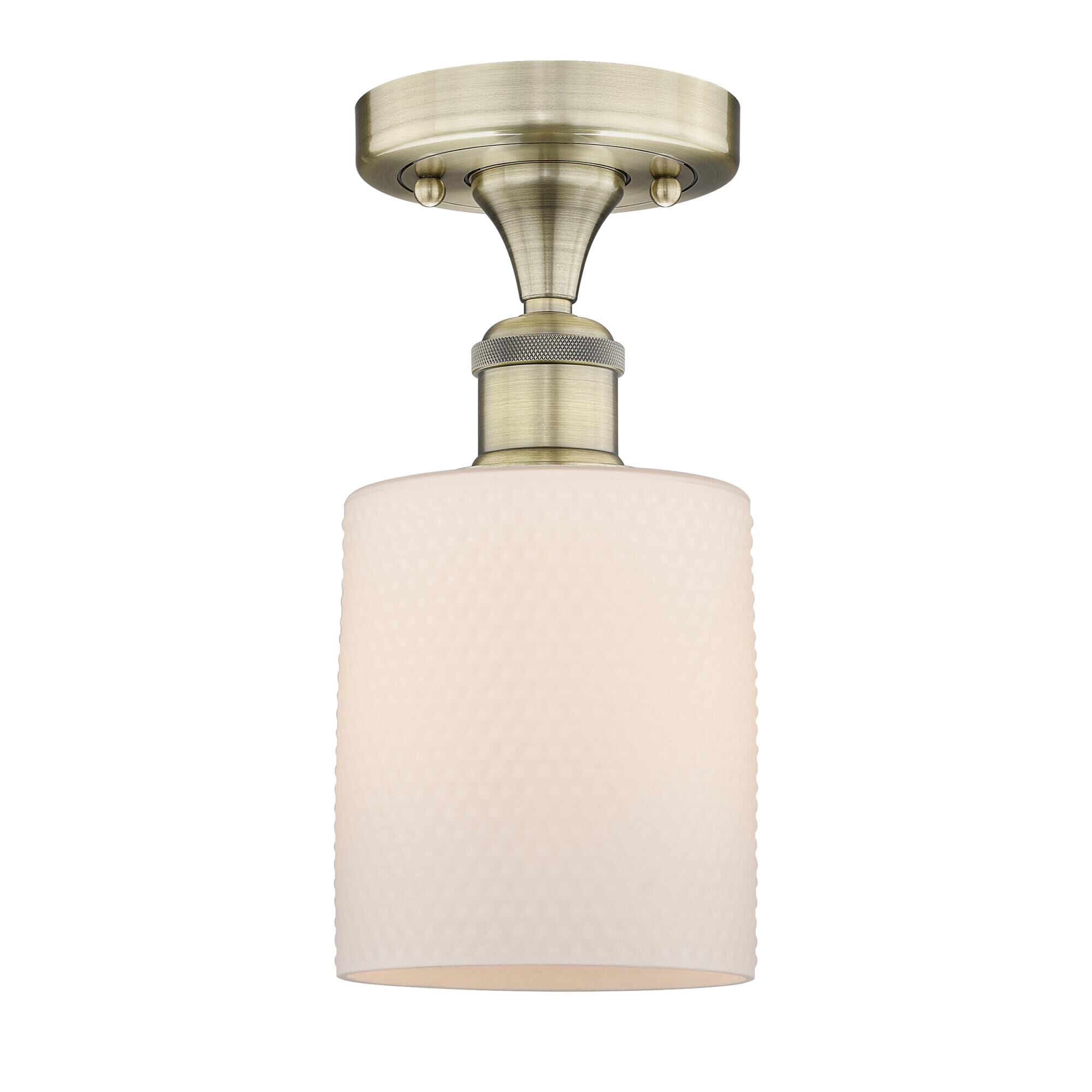 Shown in Antique Brass finish and Matte White glass