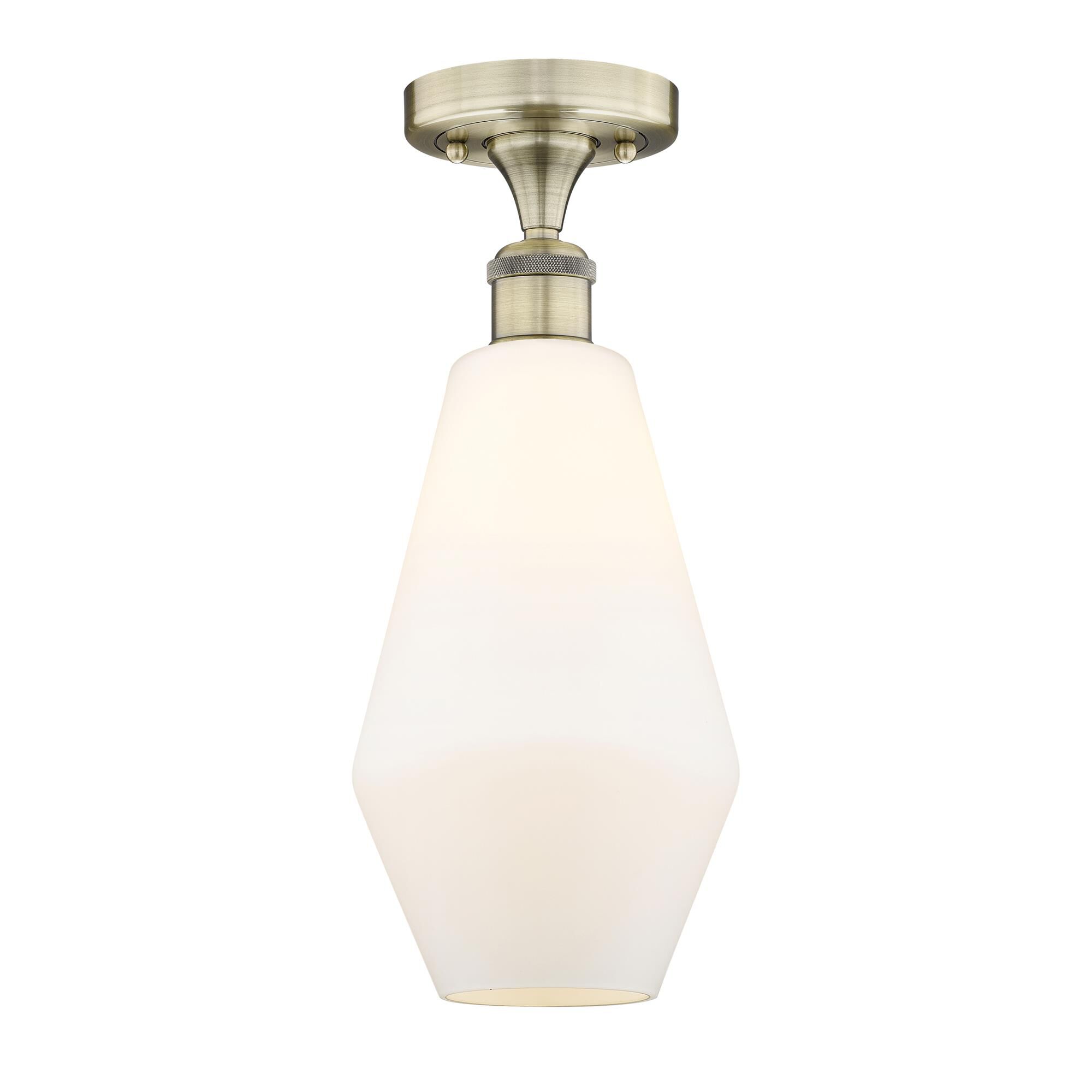 Shown in Antique Brass finish and Cased Matte White glass