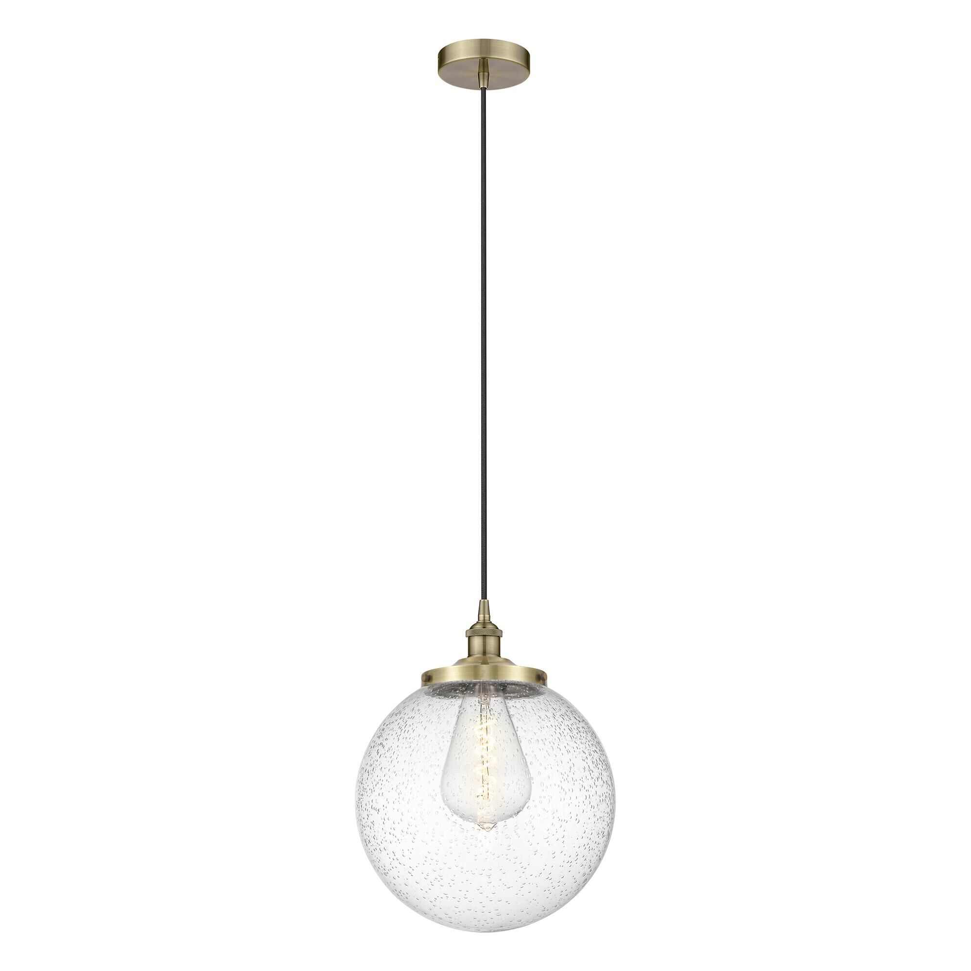 Shown in Antique Brass finish and Seedy glass
