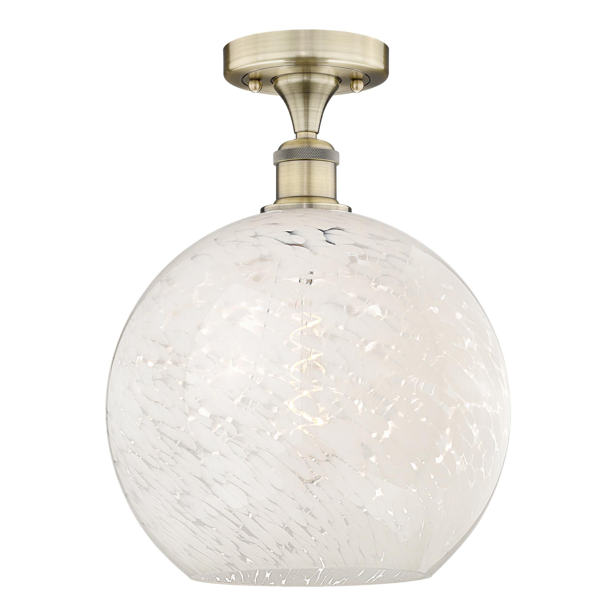 Shown in Antique Brass finish and White Mouchette glass