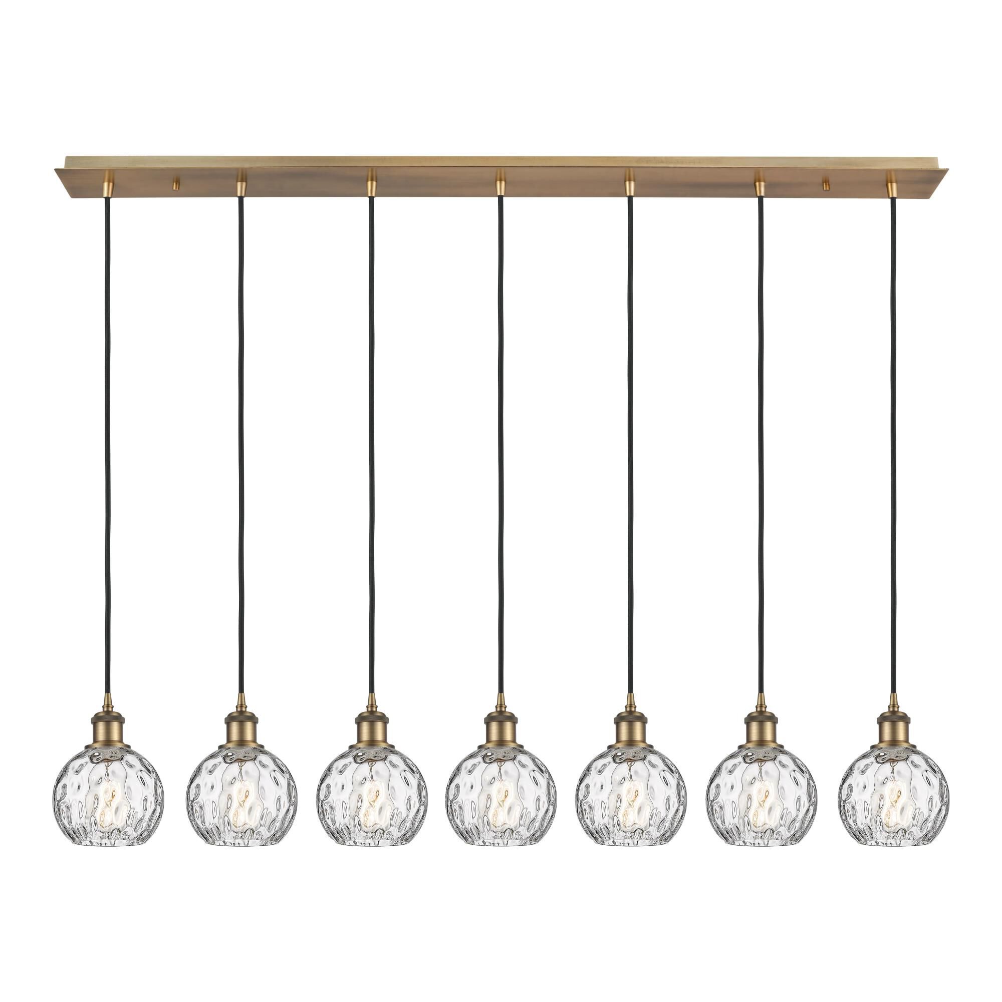 Shown in Brushed Brass finish and Athena Water Glass glass