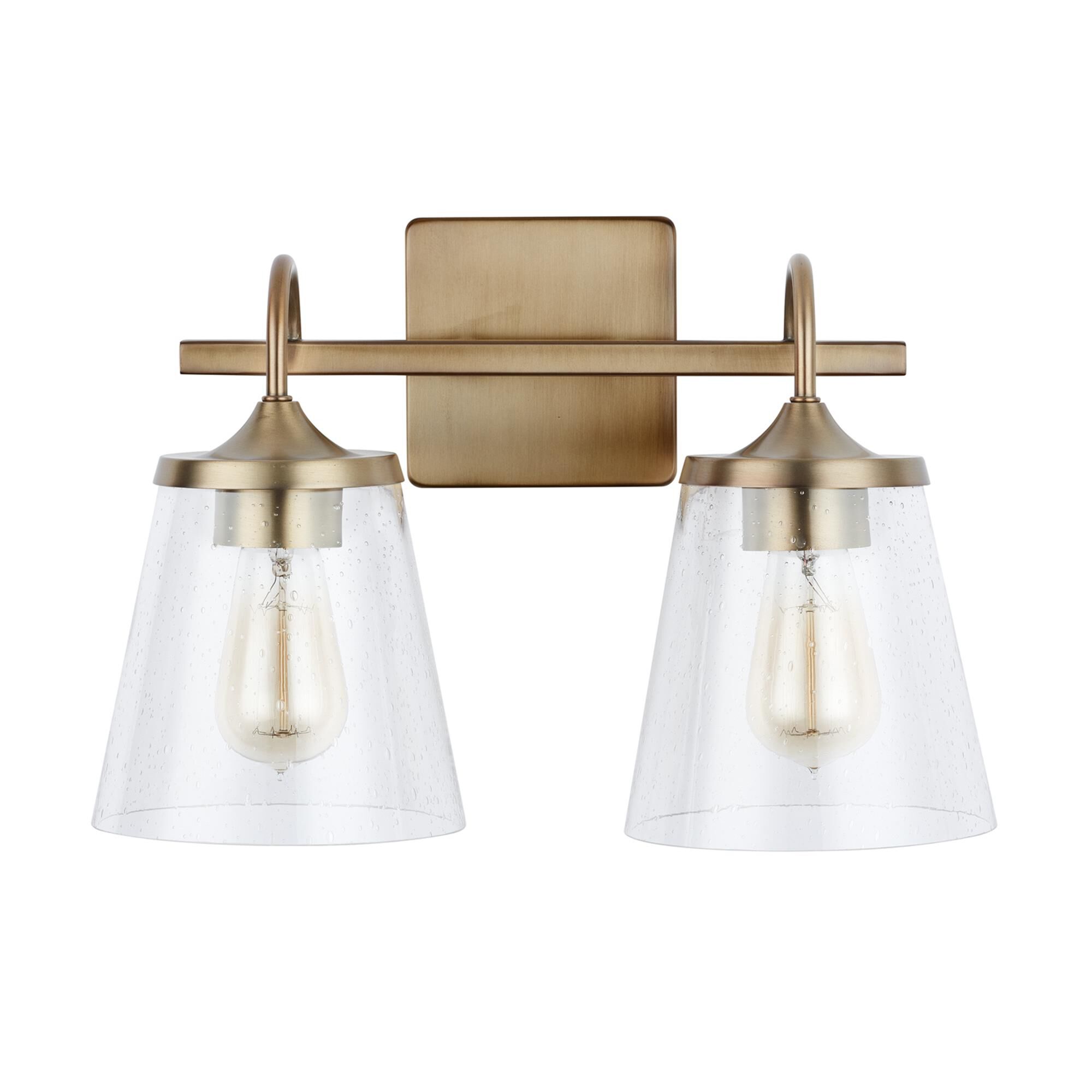 Shown in Aged Brass finish and Clear Seeded glass