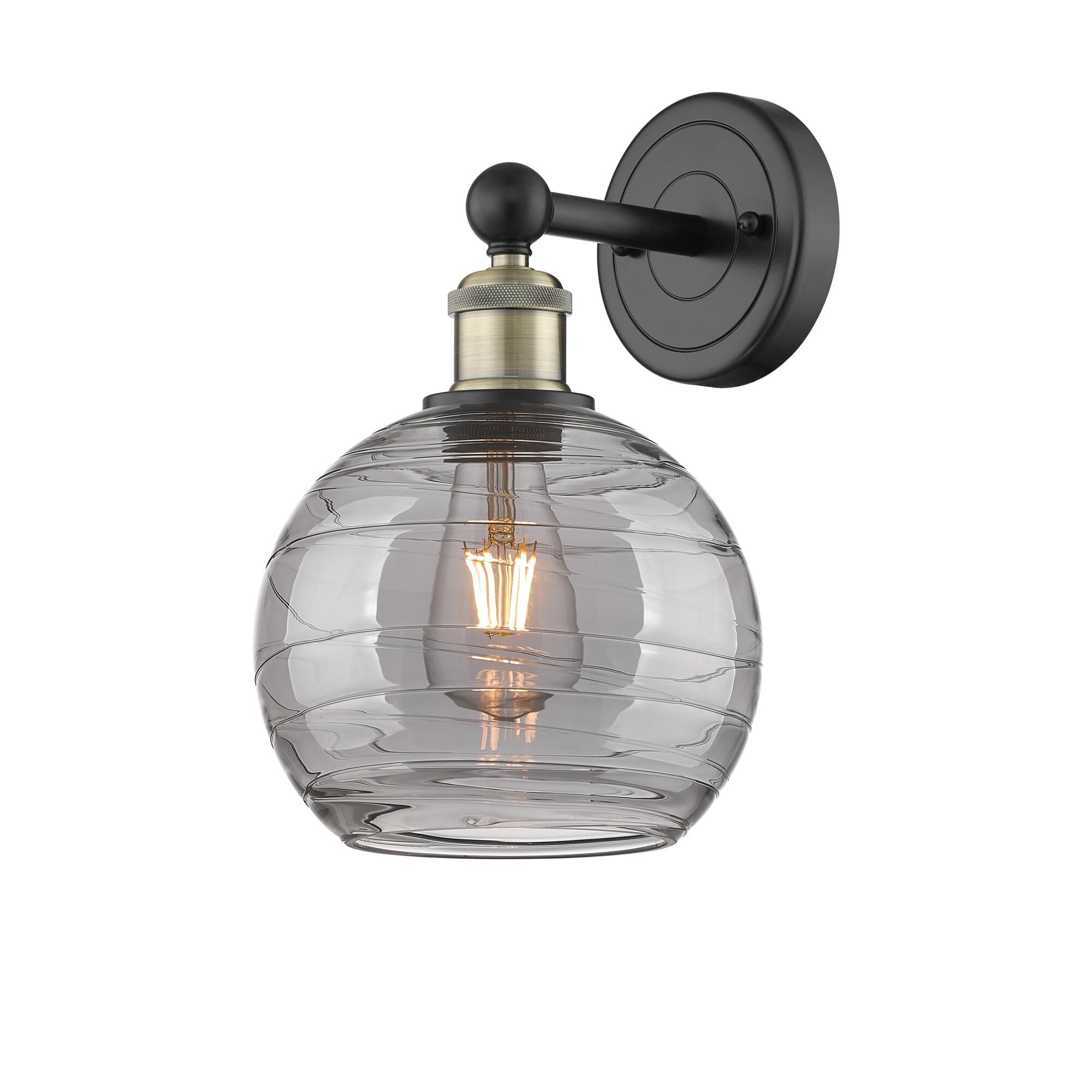 Shown in Black Antique Brass finish and Light Smoke Deco Swirl glass