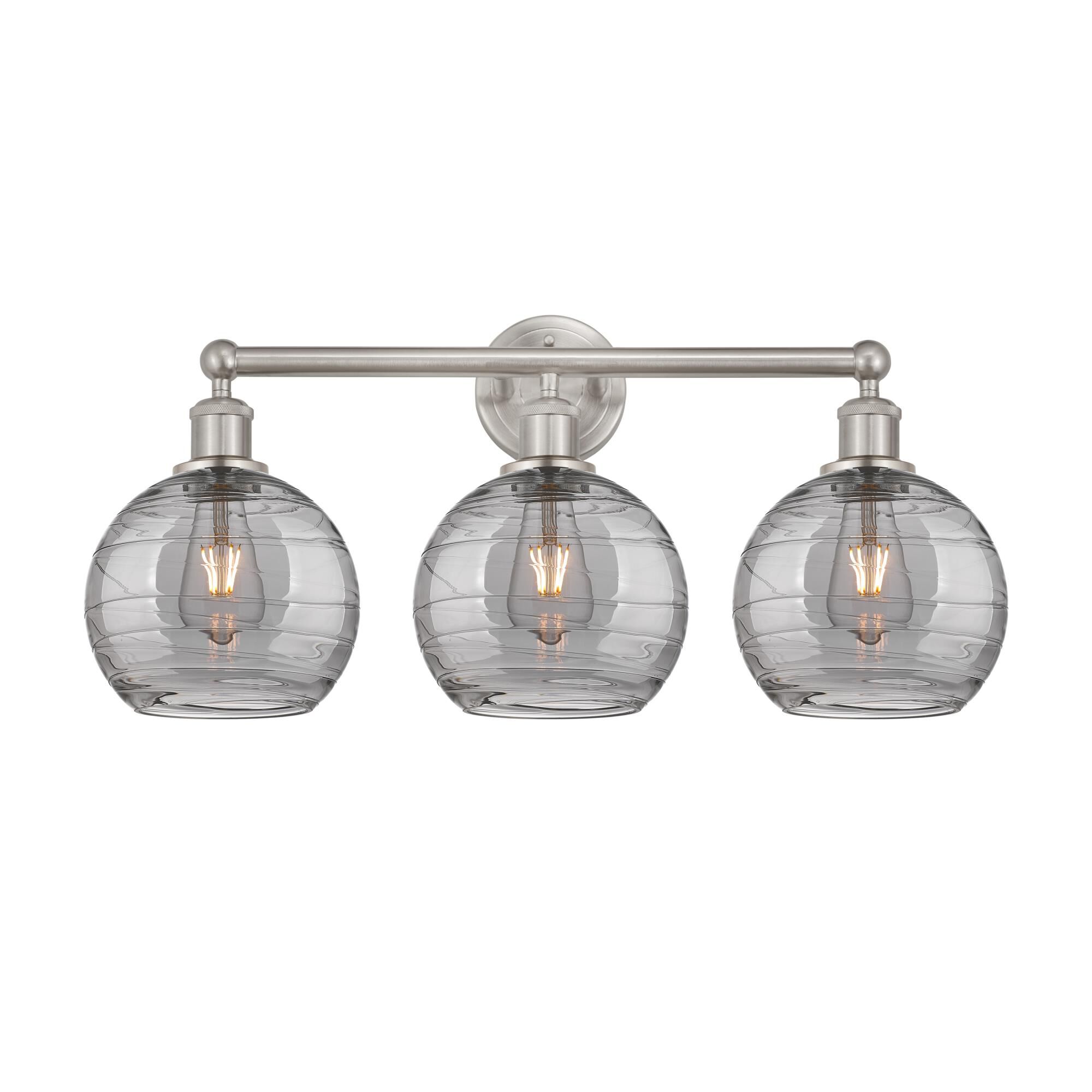 Shown in Satin Nickel finish and Light Smoke Deco Swirl glass