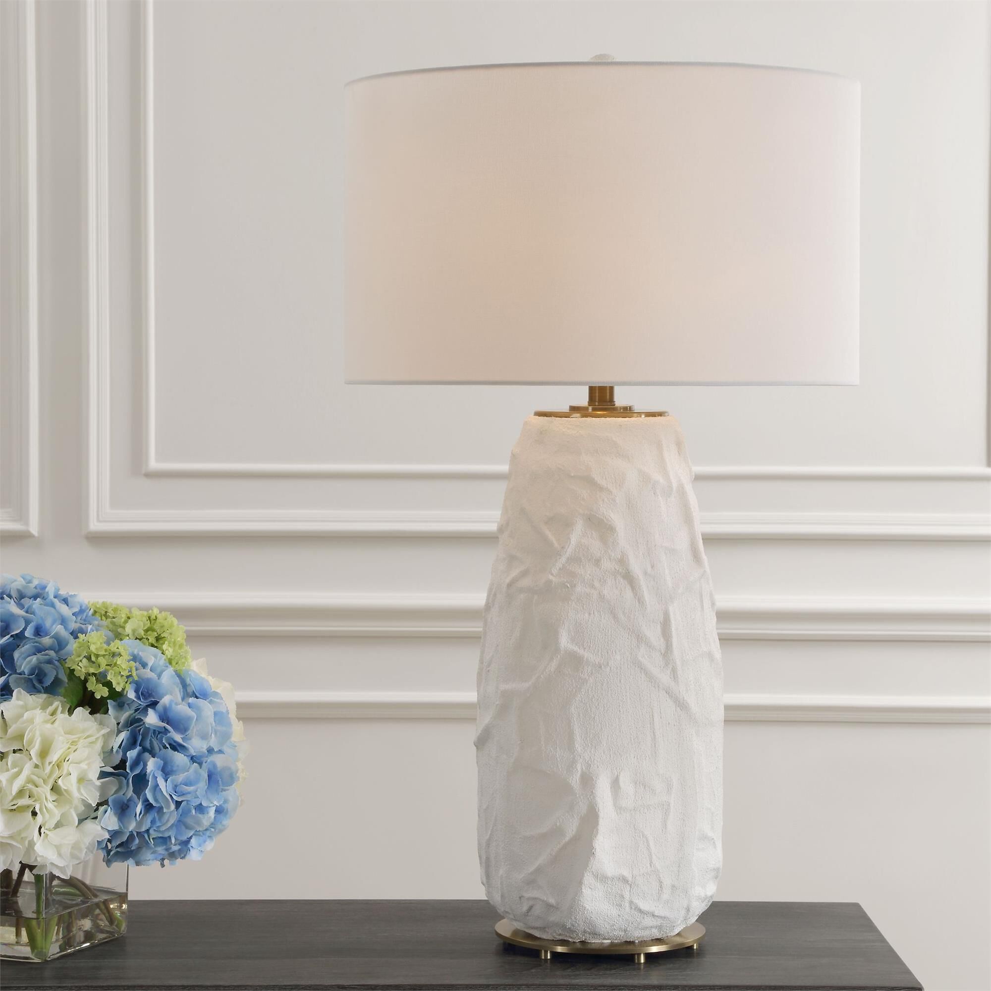 Shown in The Vida Table Lamp Base Features A Ceramic Base With A Uniquely Textured Surface And Soft, Flowing  finish and Round Drum Hardback shade