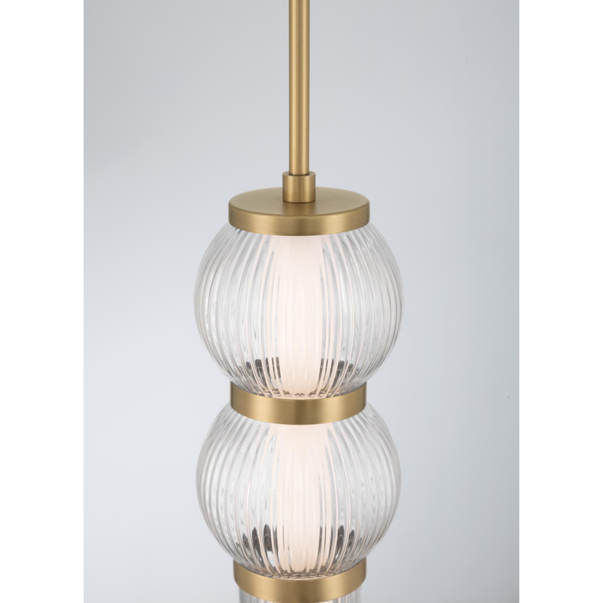 Shown in Legacy Brass finish and Clear Ribbed glass
