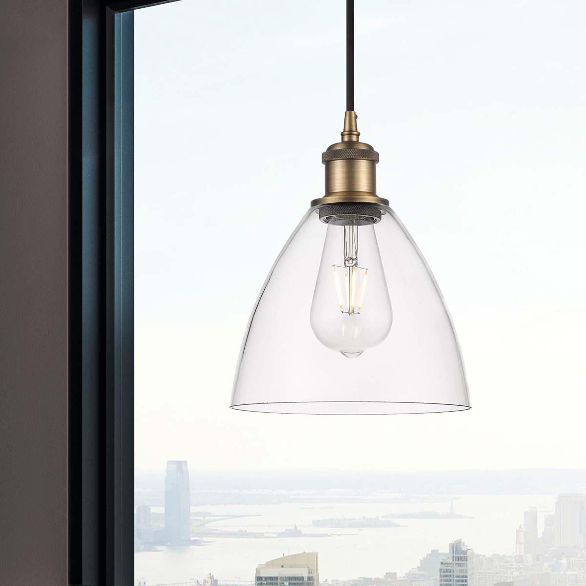 Shown in Brushed Brass finish and Cased Matte White glass