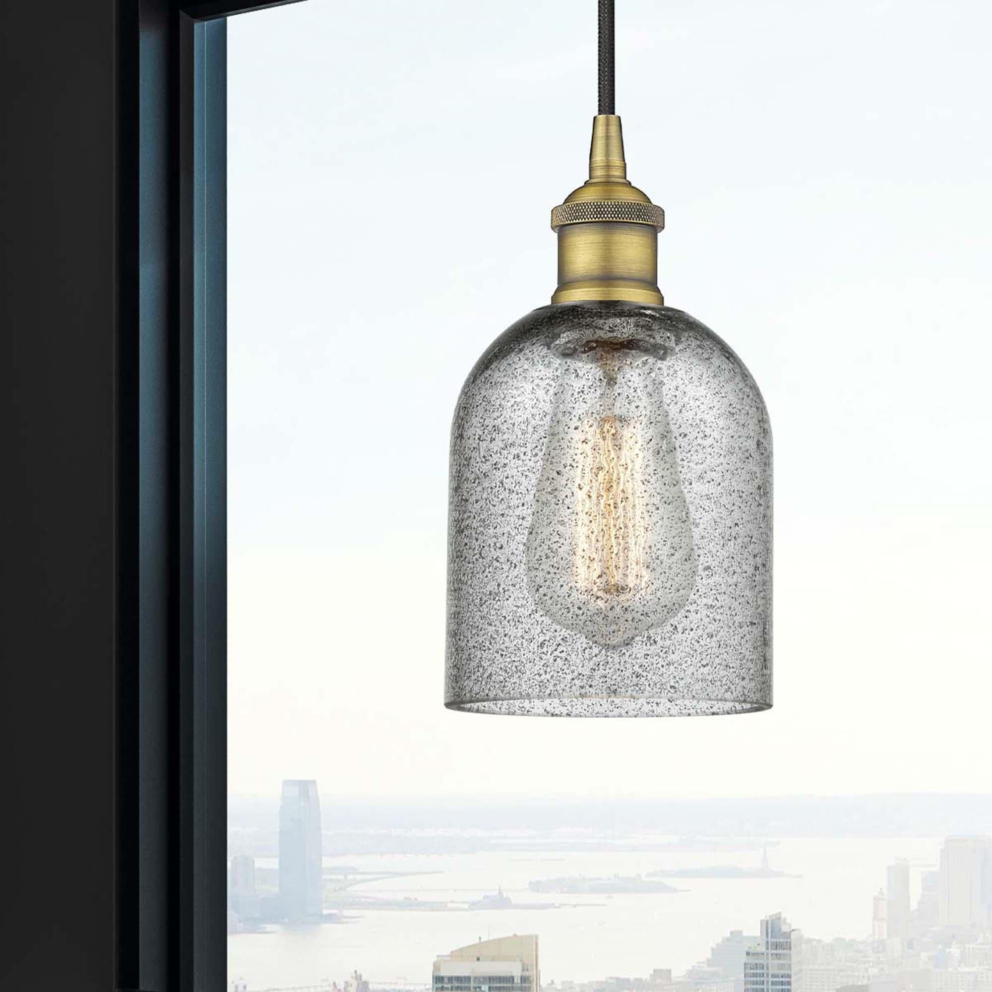 Shown in Brushed Brass finish and Charcoal glass