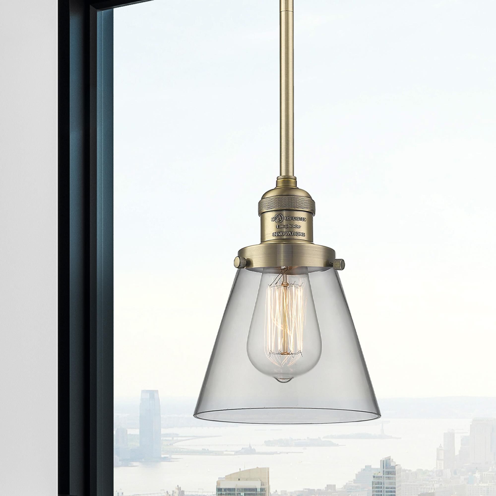 Shown in Brushed Brass finish and Clear glass