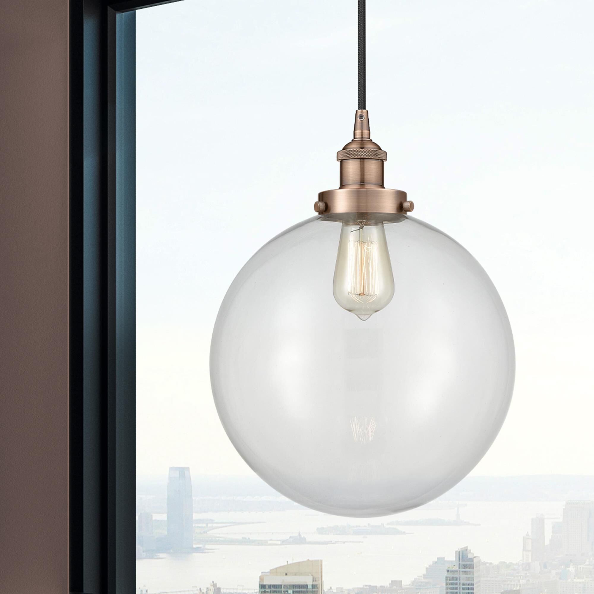 Shown in Antique Copper finish and Clear Beacon glass