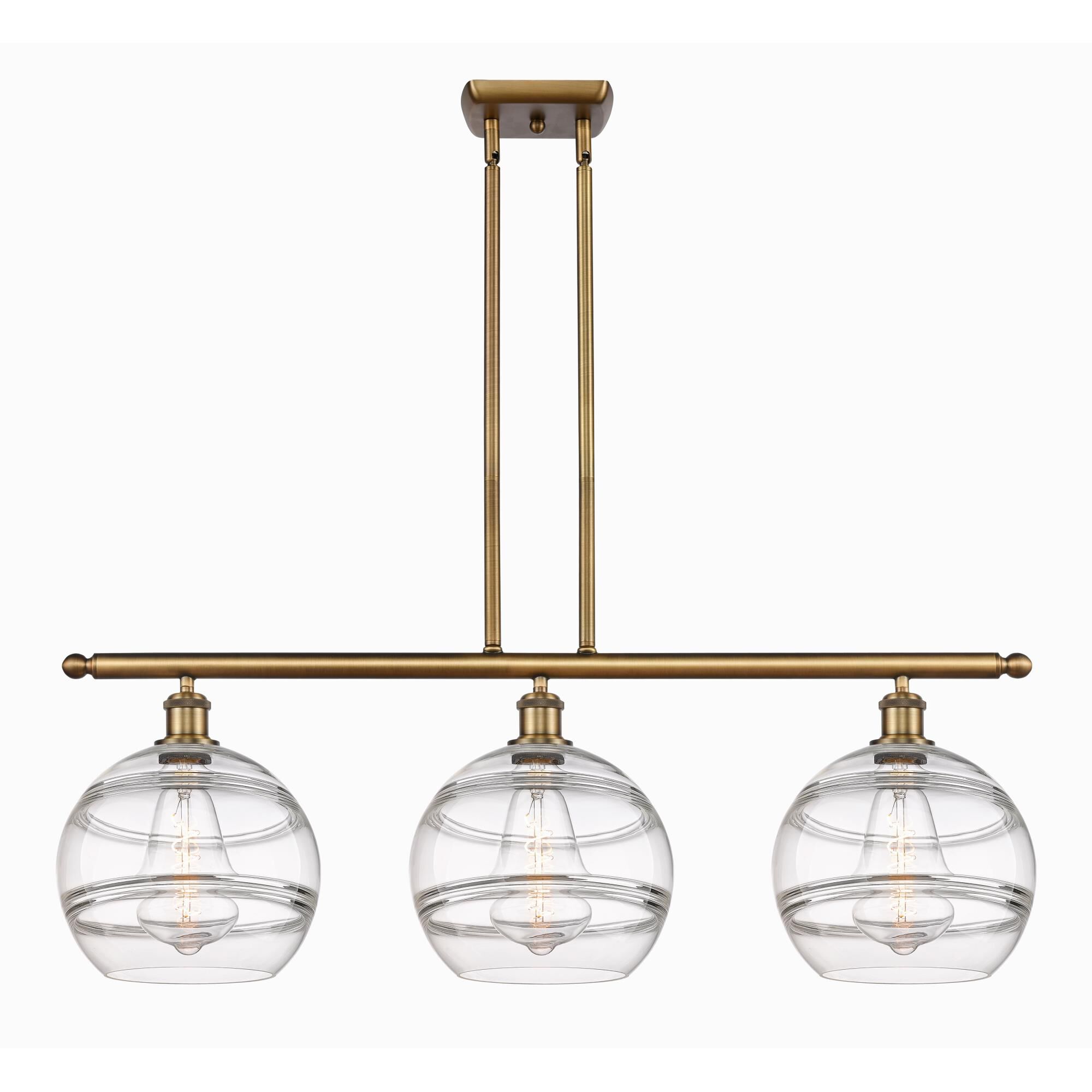 Shown in Brushed Brass finish and Clear glass