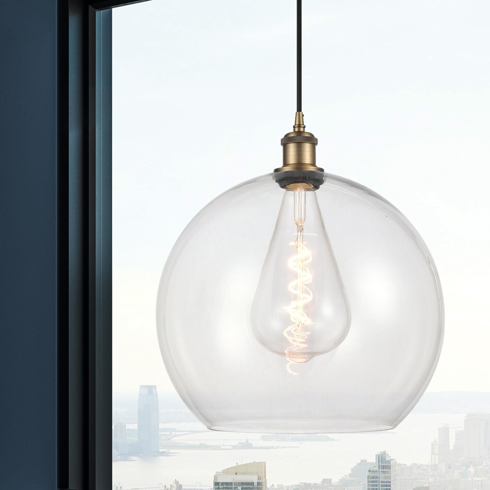 Shown in Brushed Brass finish and Clear glass