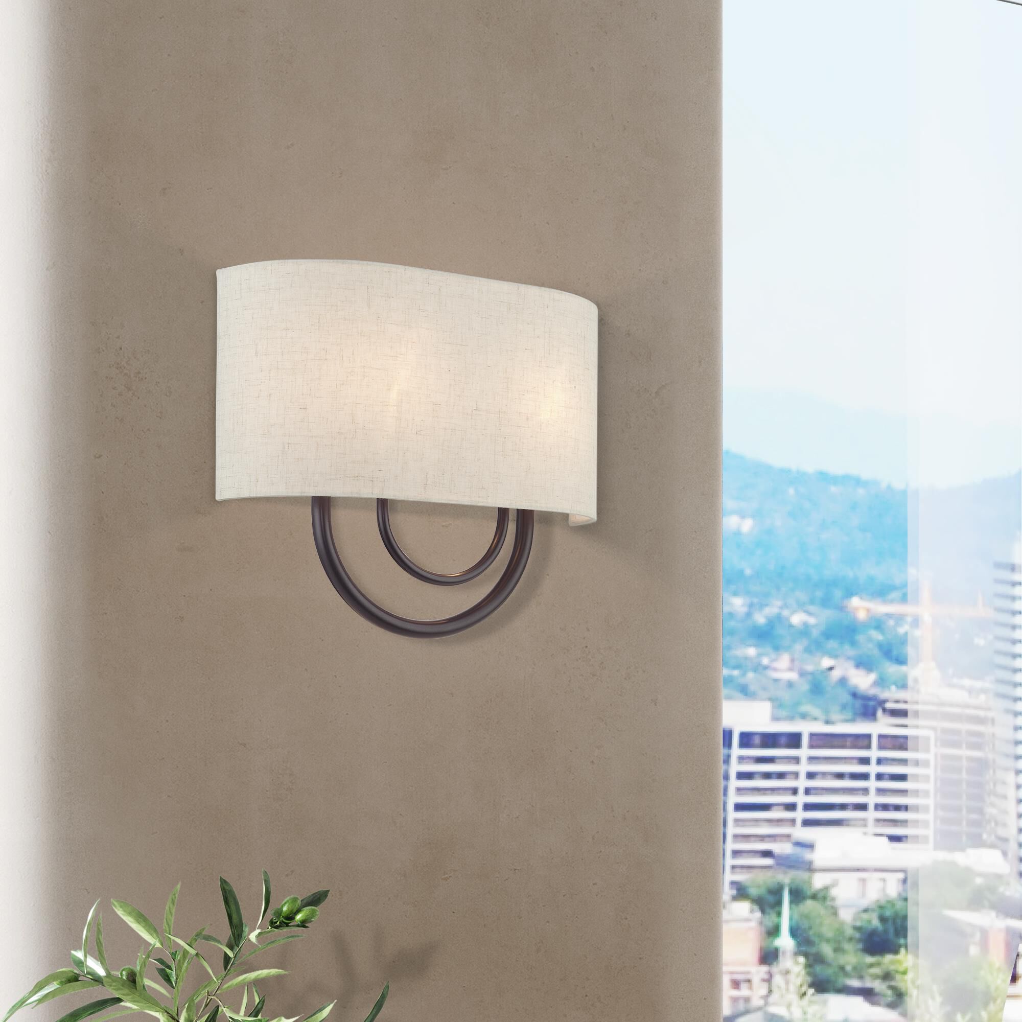 Shown in English Bronze finish and Hand Crafted Oatmeal Color Fabric Hardback with White Fabric Inside shade