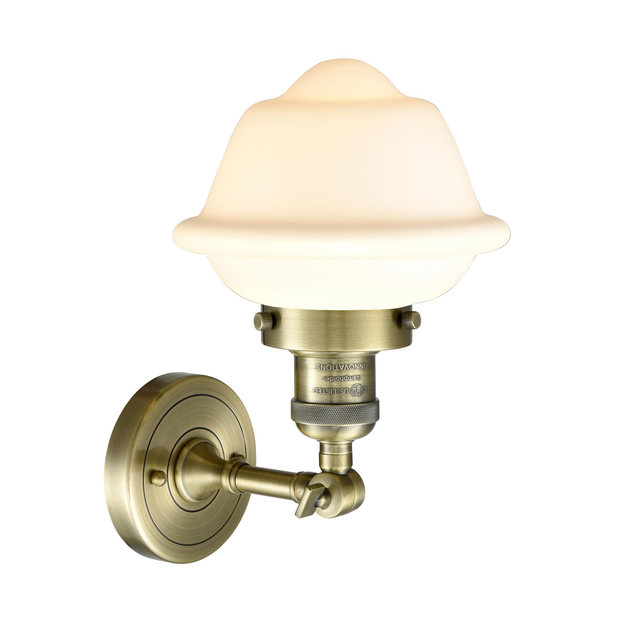 Shown in Antique Brass finish and Matte White Cased glass