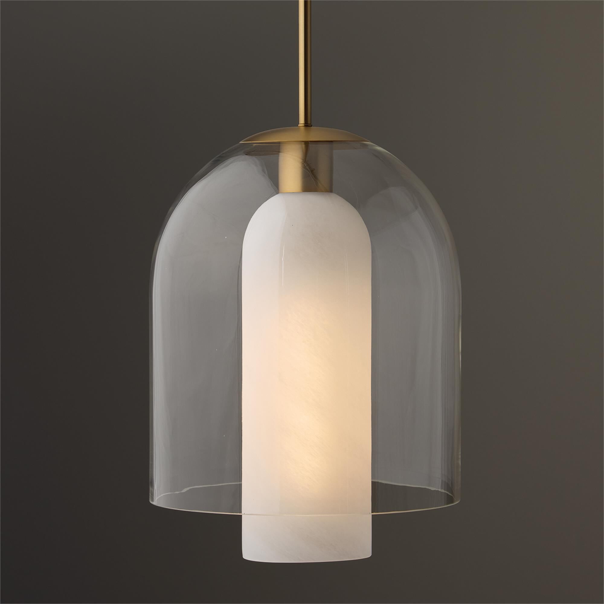 Shown in Aged Brass finish and Clear And Faux Alabaster glass