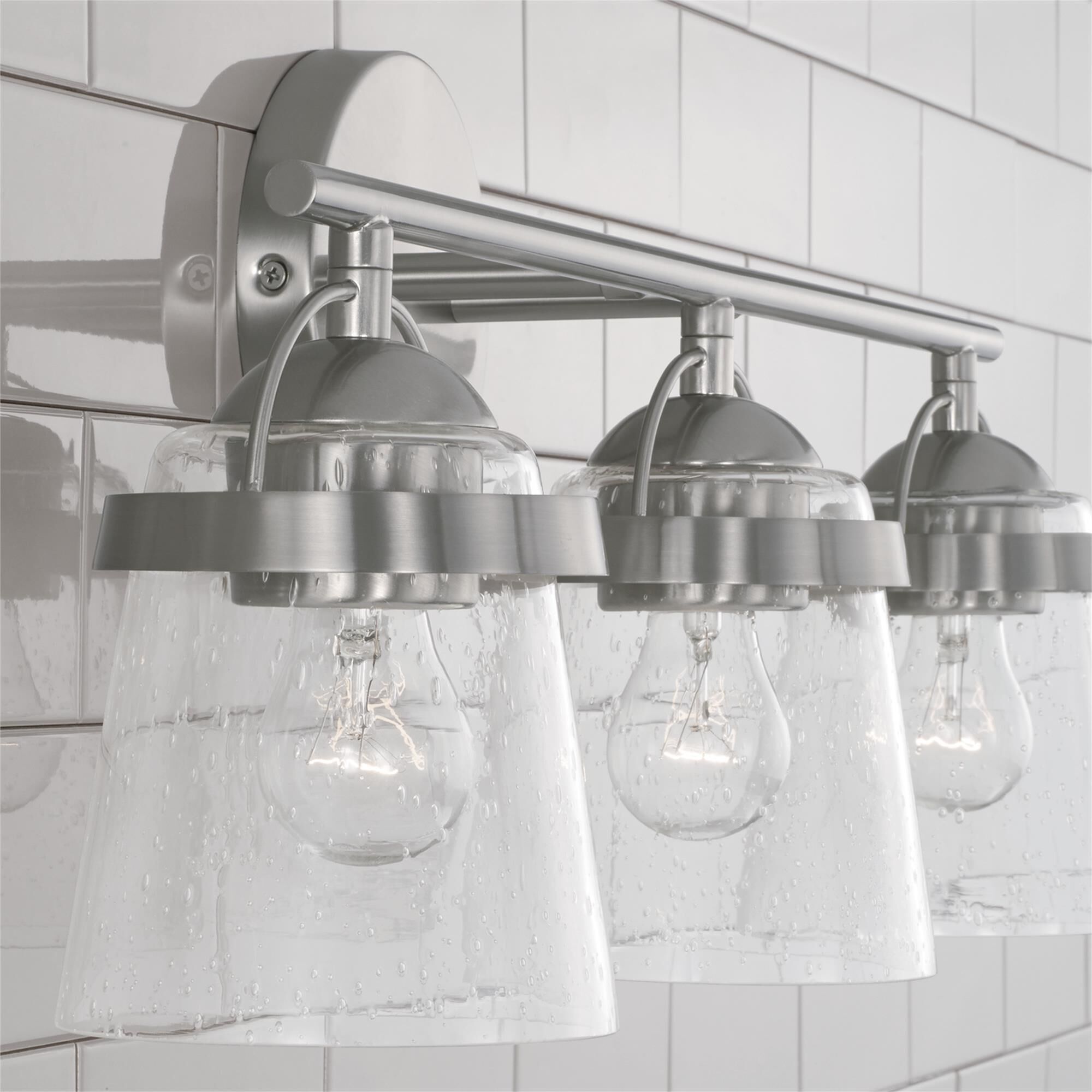 Shown in Brushed Nickel finish and Clear Seeded glass