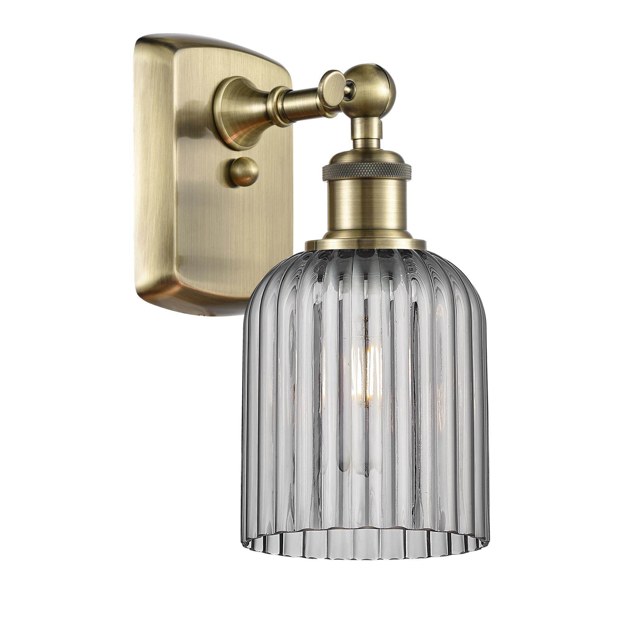 Shown in Antique Brass finish and Light Smoke shade