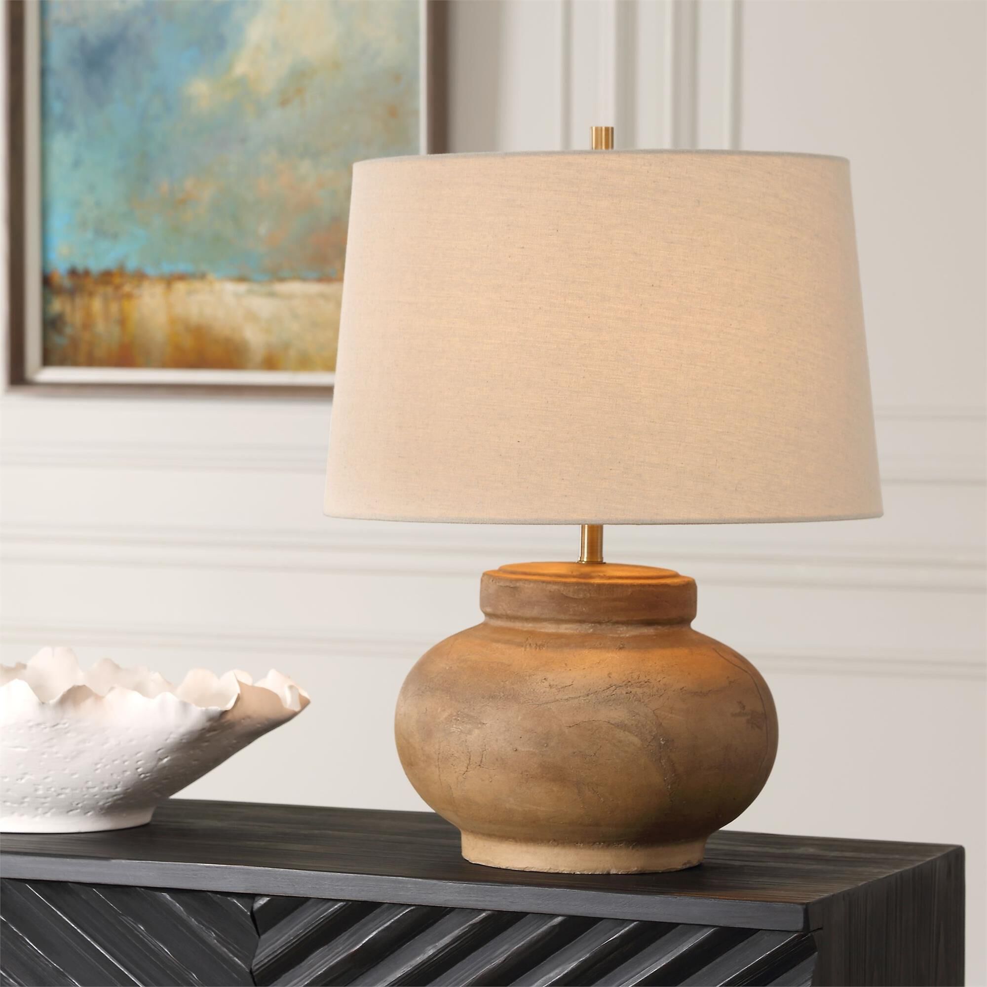 Shown in Crafted With A Distressed Terracotta Base, The Urbino Table Lamp Exudes Warmth And Character With It finish and Round Hardback  Rolled Edge shade