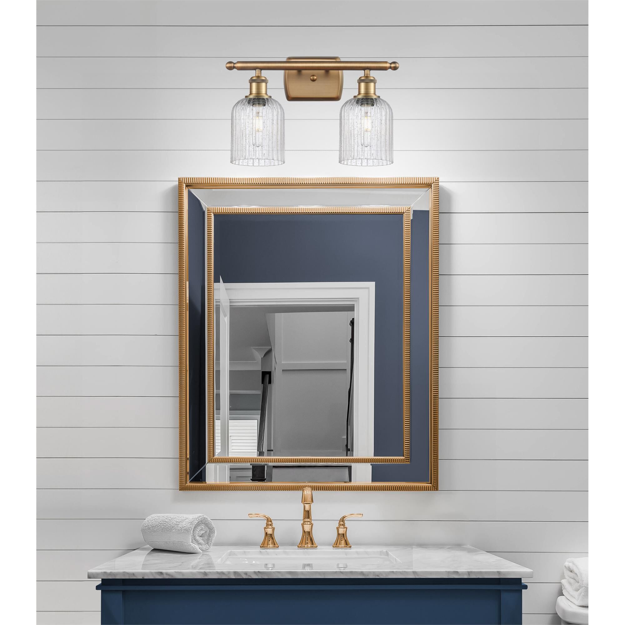 Shown in Brushed Brass finish and Seedy glass