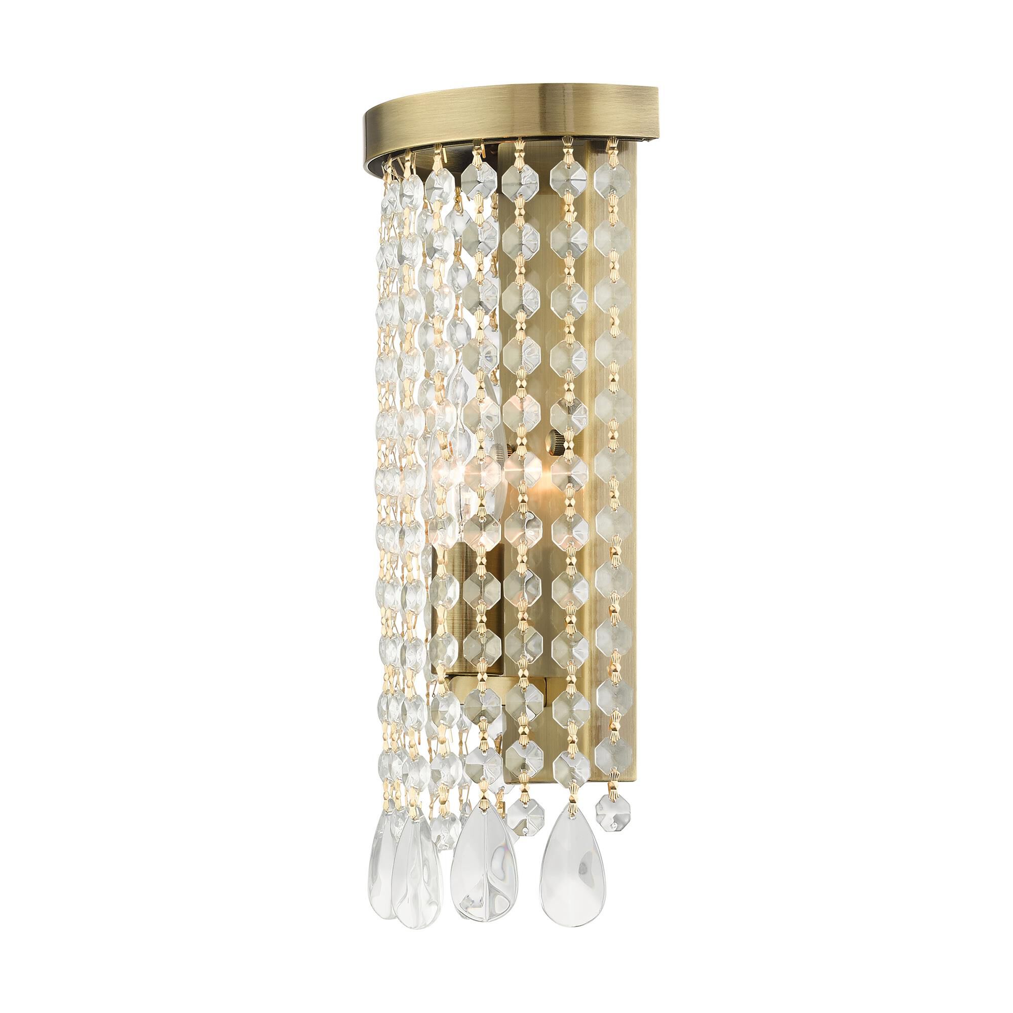 Shown in Antique Brass finish and Hand Assembled Crystal Shade glass