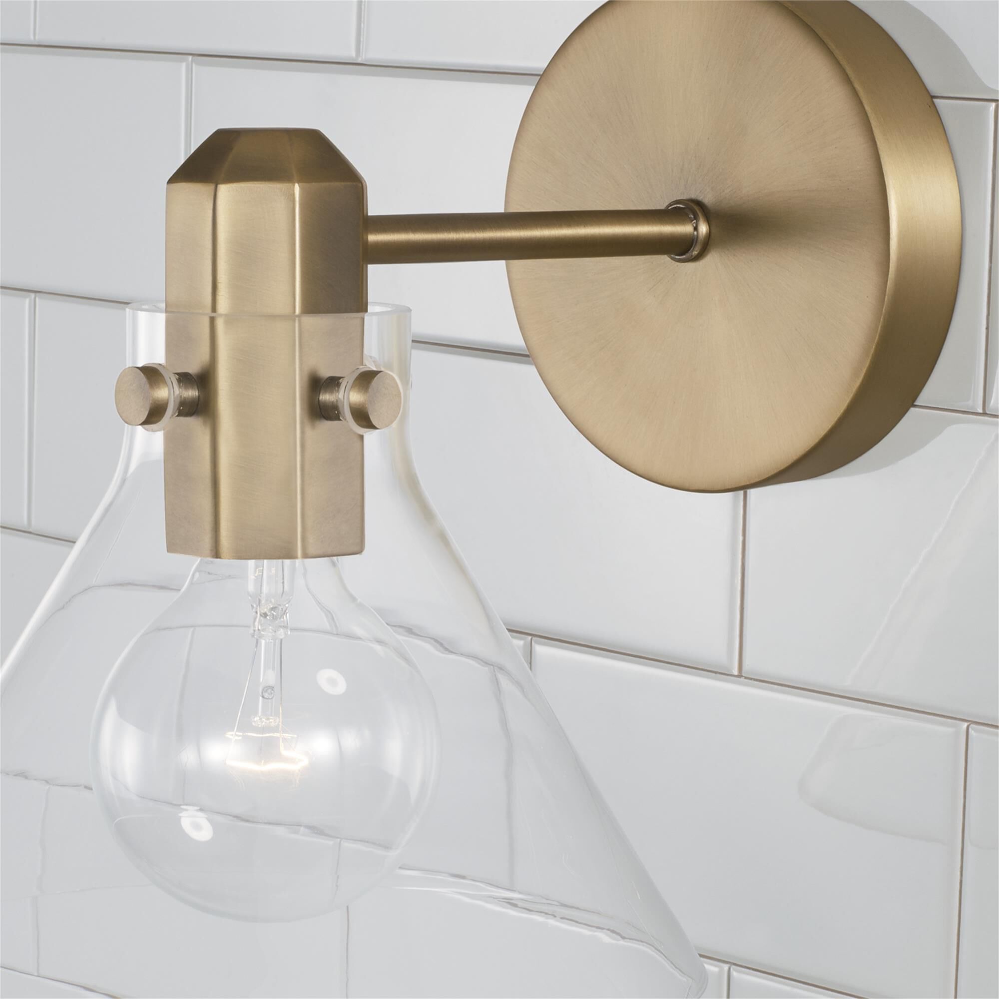 Shown in Aged Brass finish and Clear glass