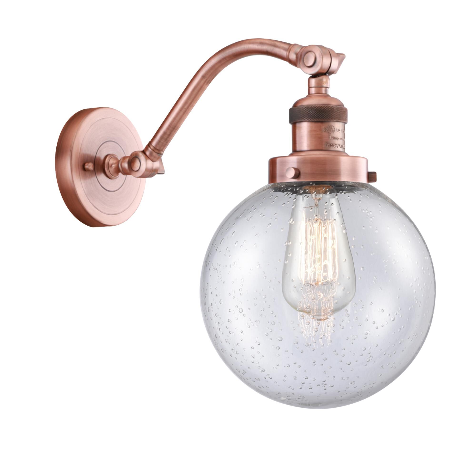 Shown in Antique Copper finish and Seedy Beacon glass