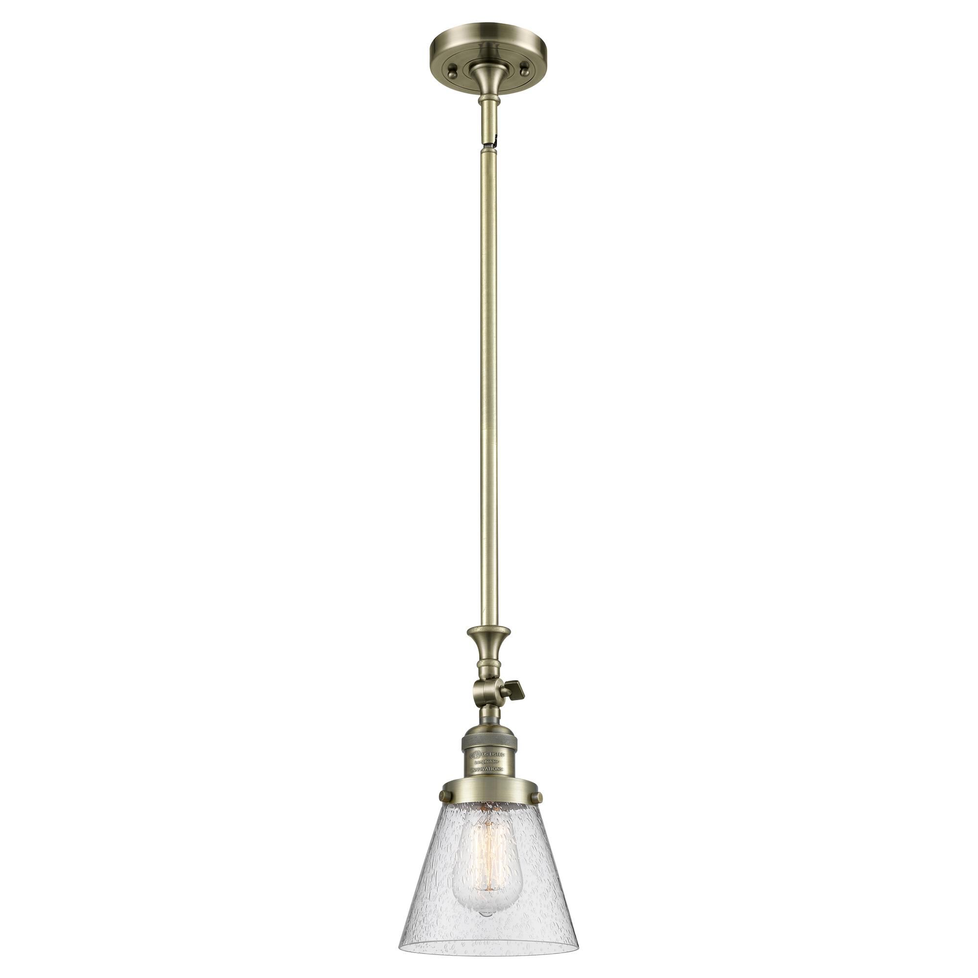Shown in Antique Brass finish and Seedy glass