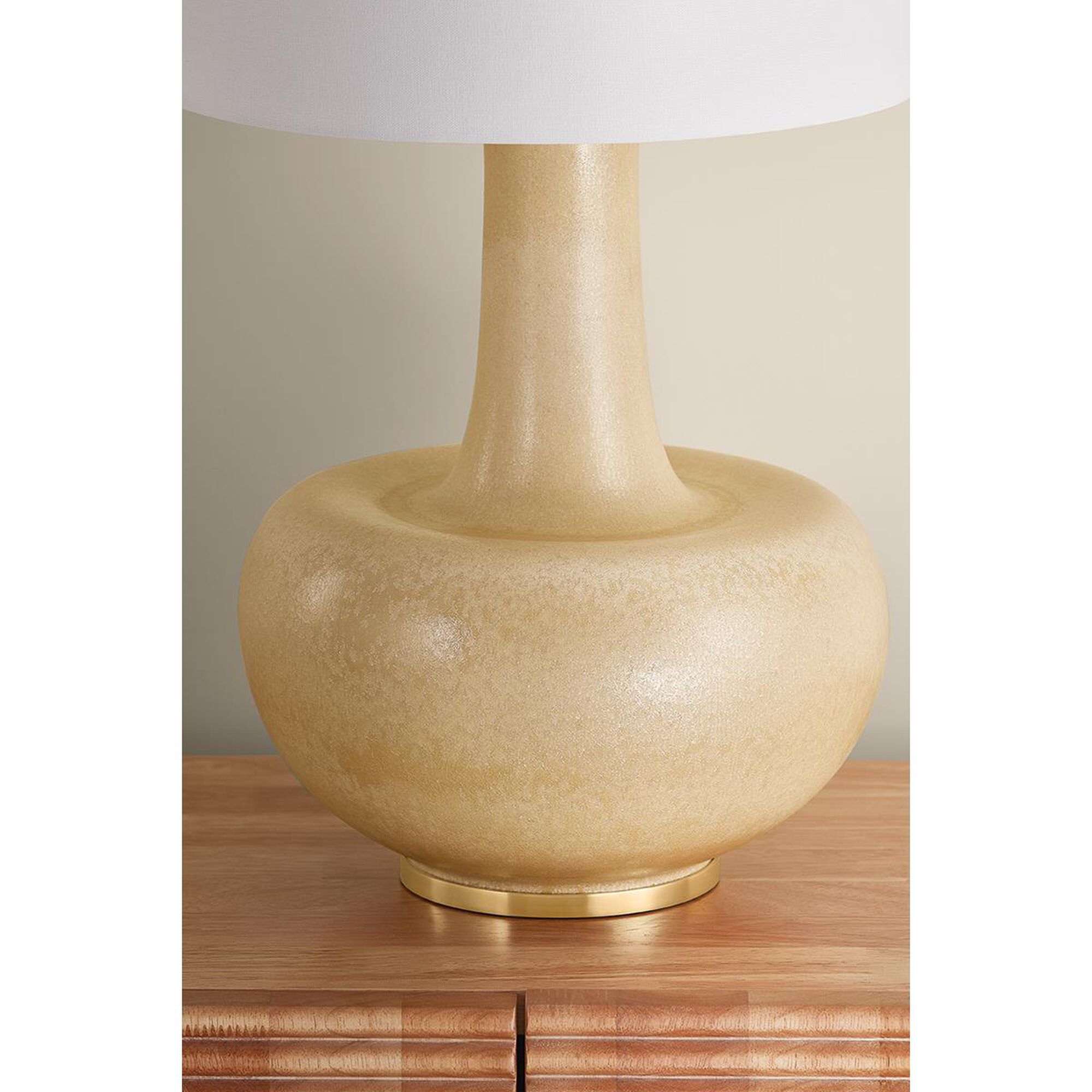Shown in Aged Brass and Ceramic Biscotti Reactive finish and Textured Linen shade