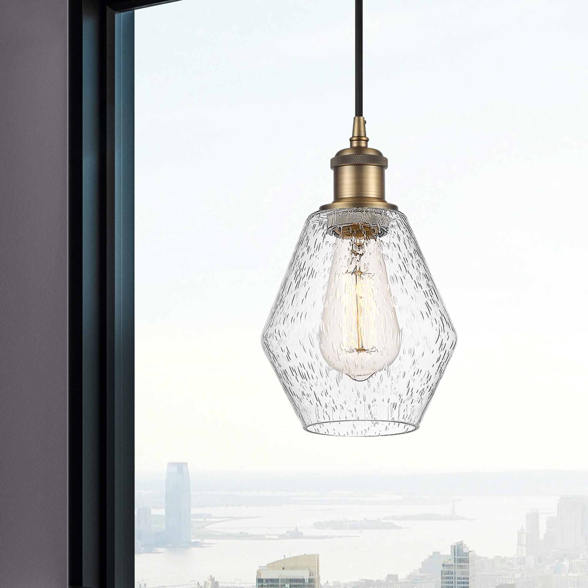 Shown in Brushed Brass finish and Seedy glass