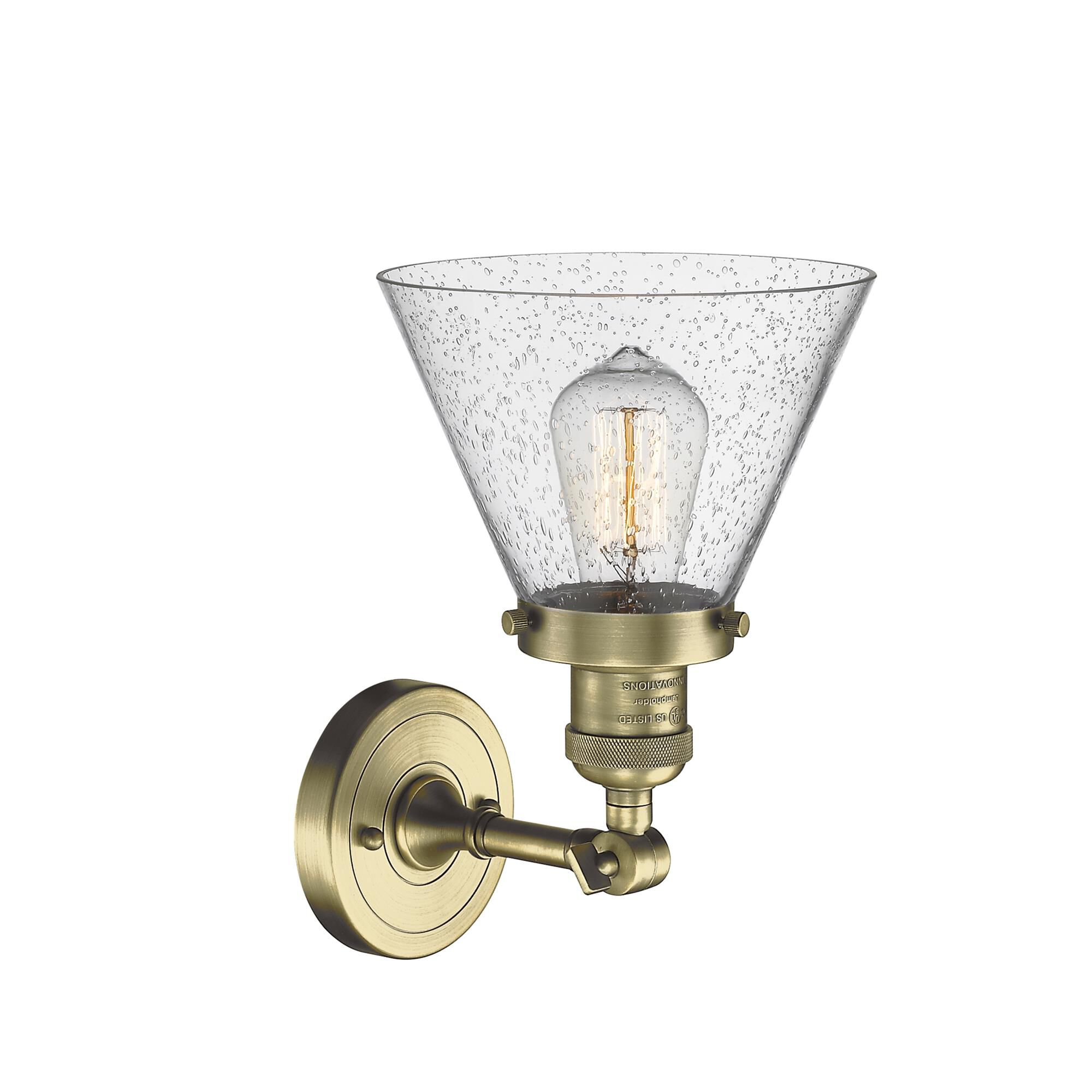 Shown in Antique Brass finish and Seedy glass