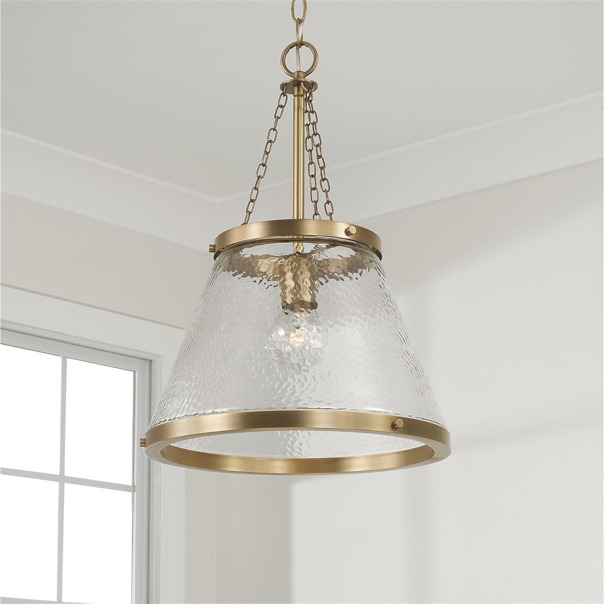 Shown in Aged Brass finish and Organic Hammered glass