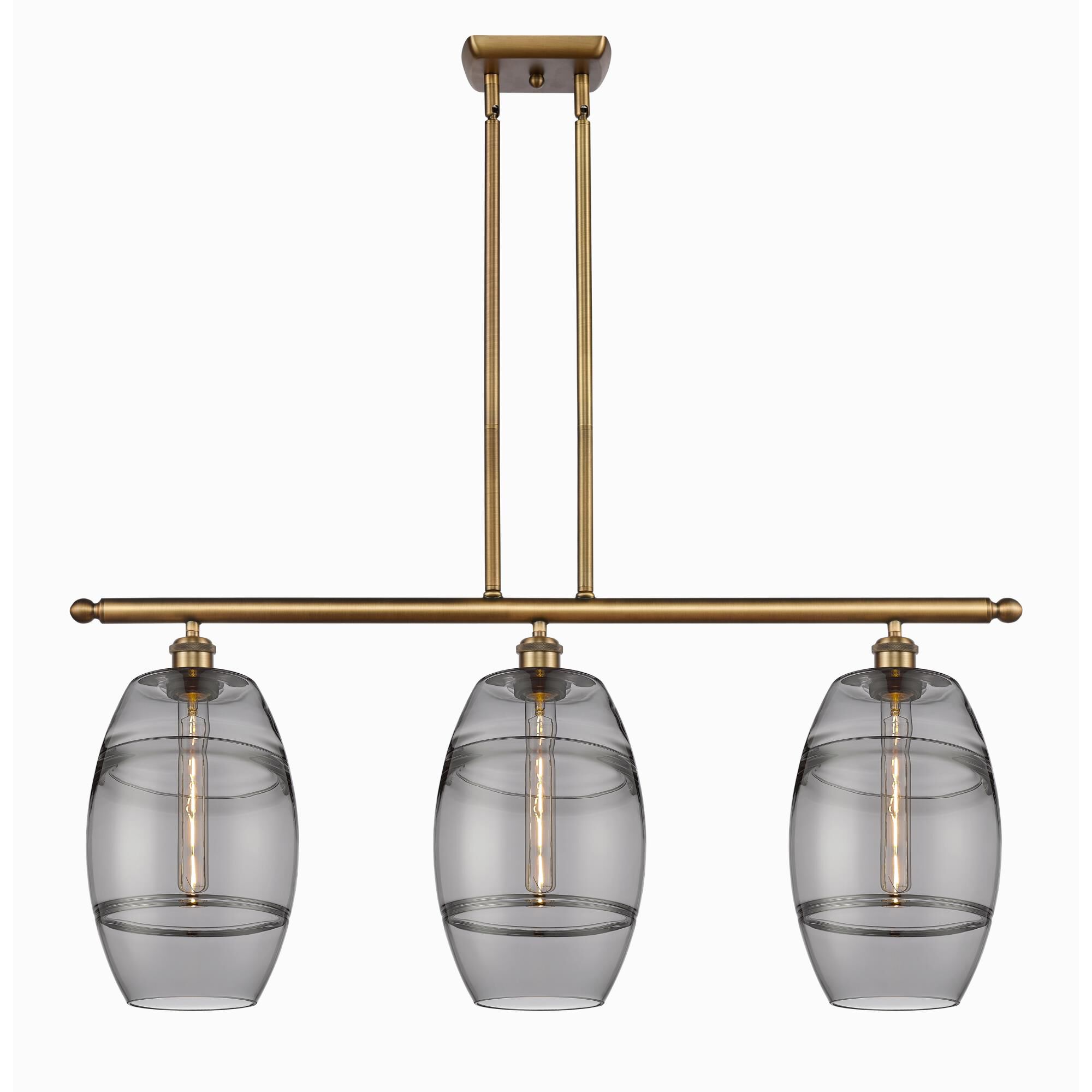 Shown in Brushed Brass finish and Light Smoke glass