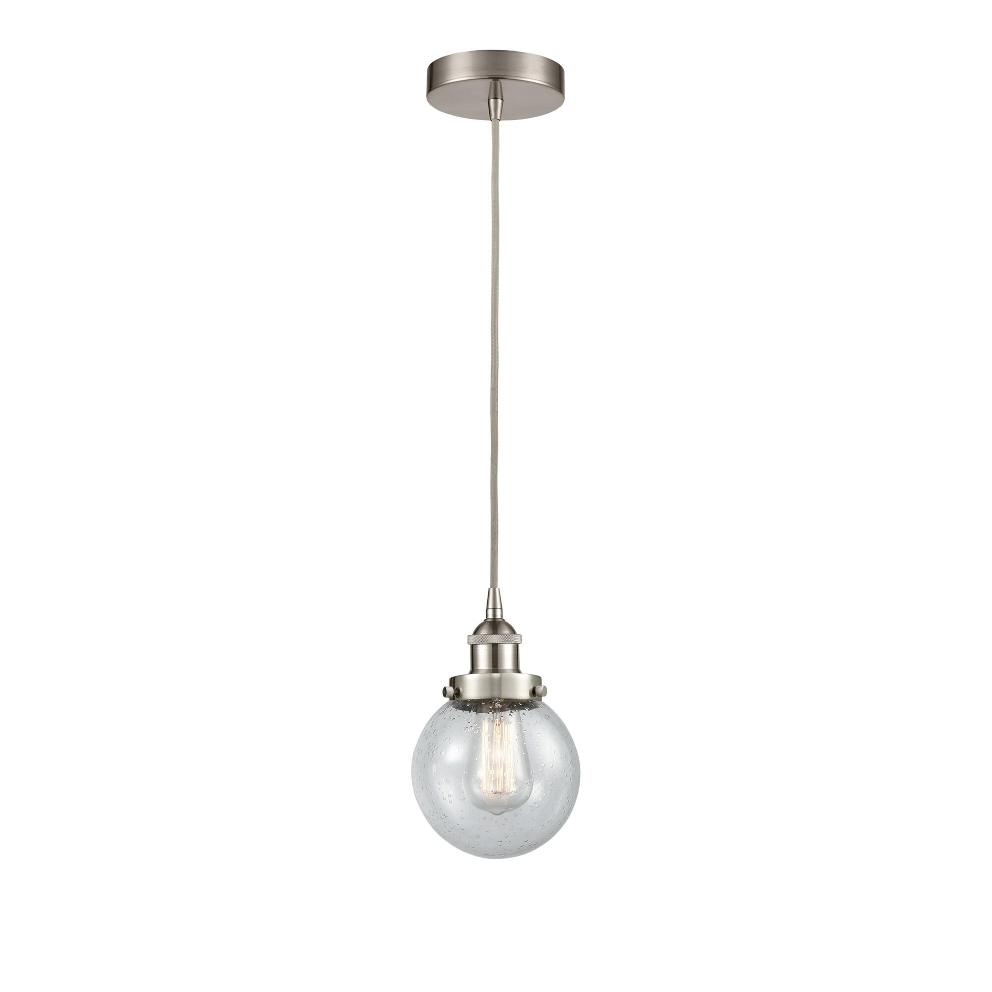 Shown in Brushed Satin Nickel finish and Seedy Beacon glass