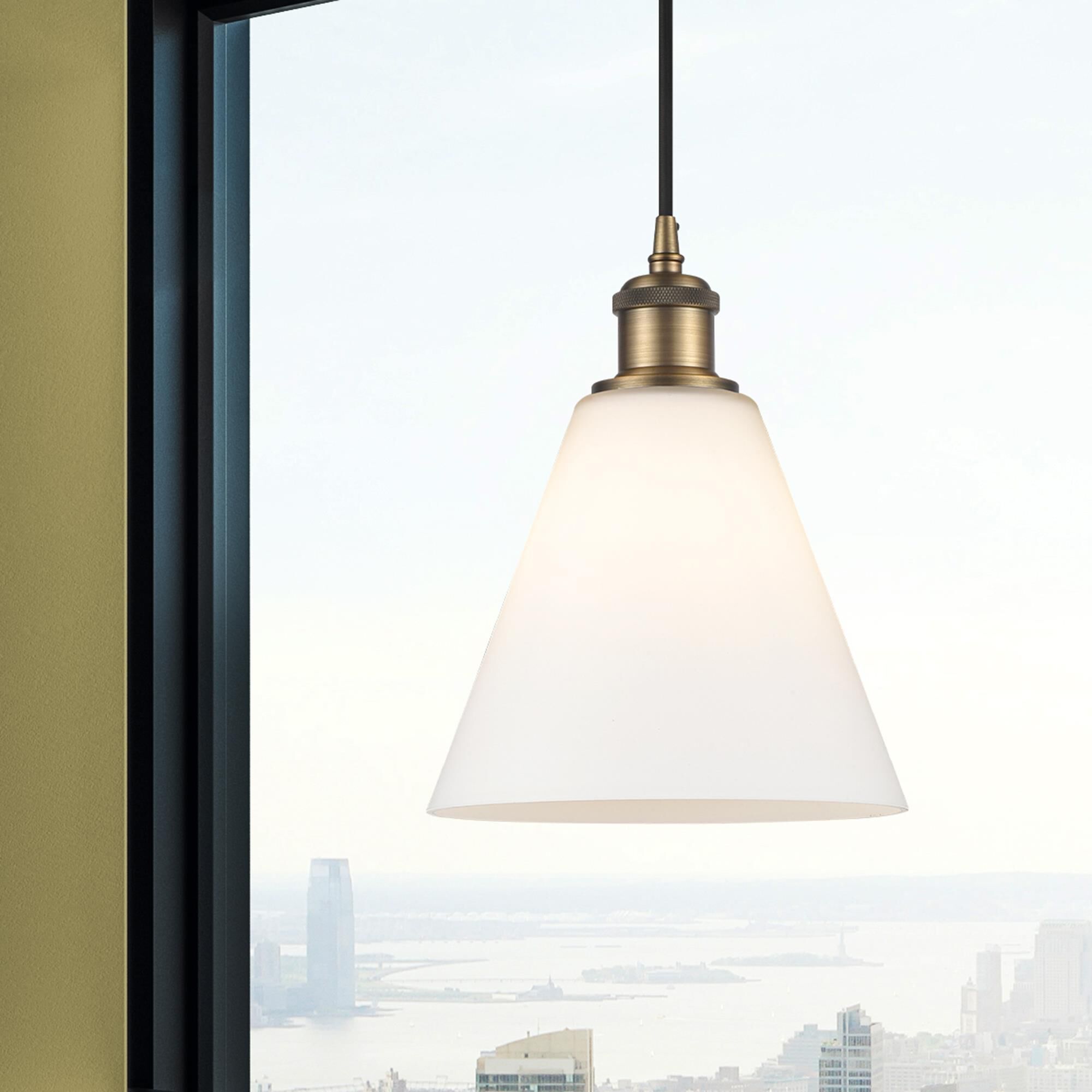Shown in Brushed Brass finish and Matte White glass
