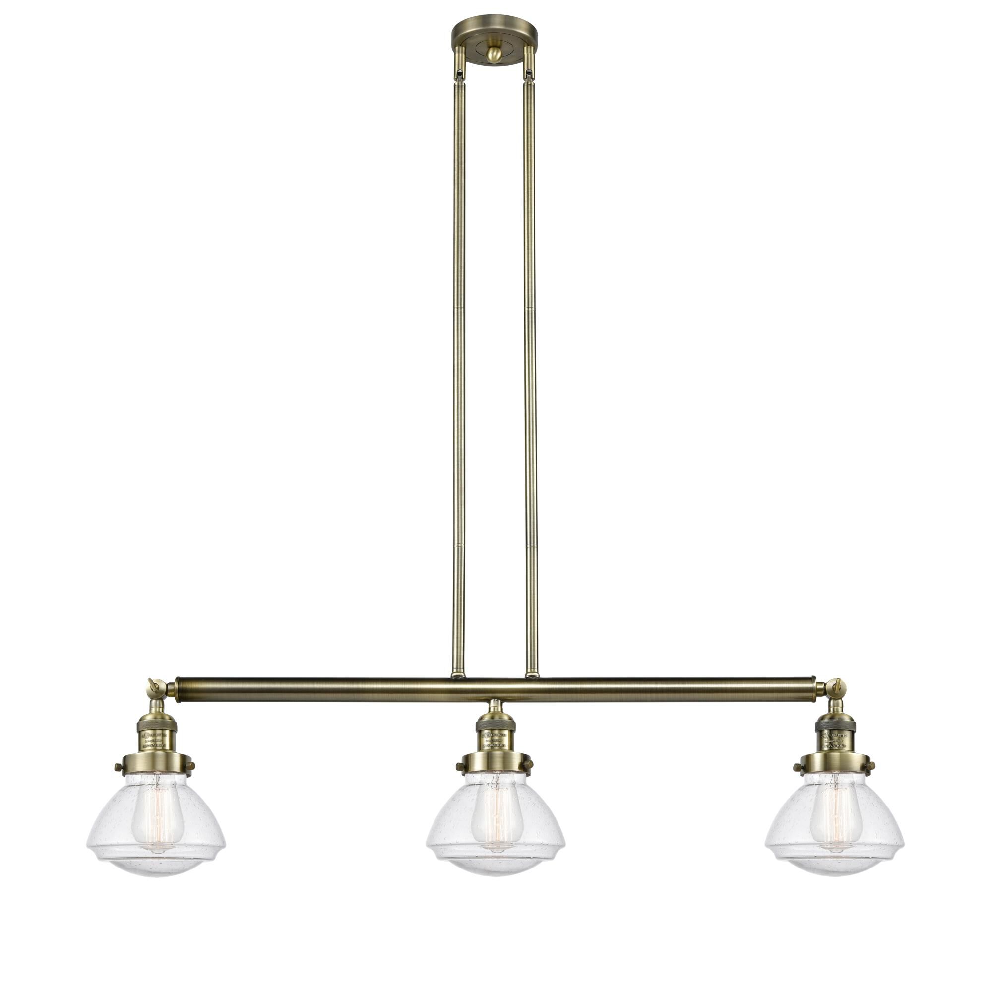 Shown in Antique Brass finish and Seedy Olean glass