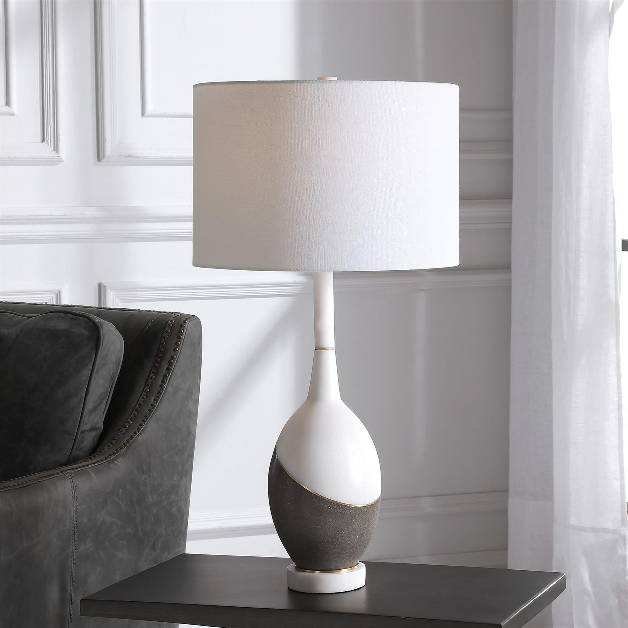 Shown in Simple Yet Sophisticated, This Table Lamp Features A Combination Of Honed Charcoal Concrete And A Po finish and Round Drum Hardback shade