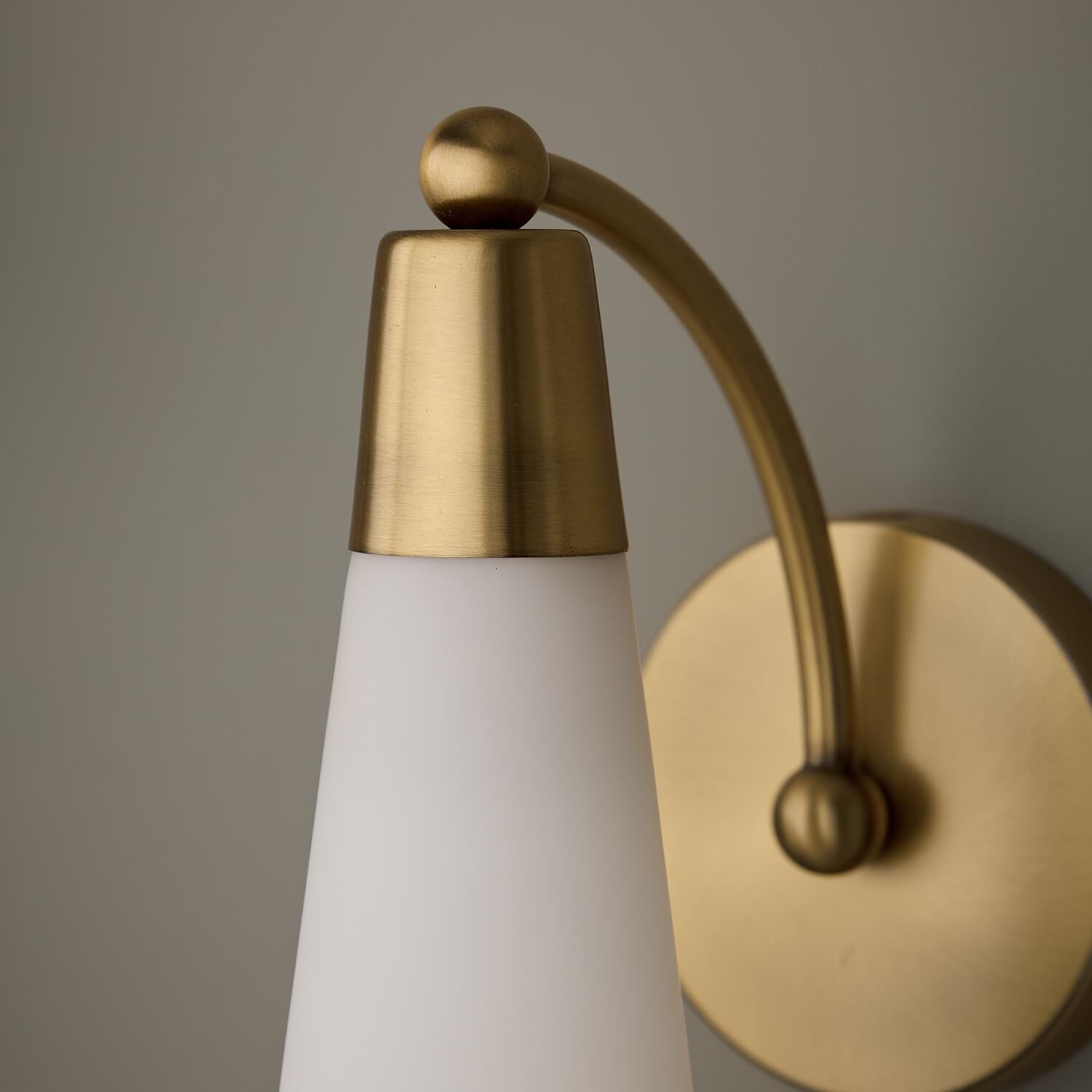 Shown in Aged Brass finish and Soft White glass